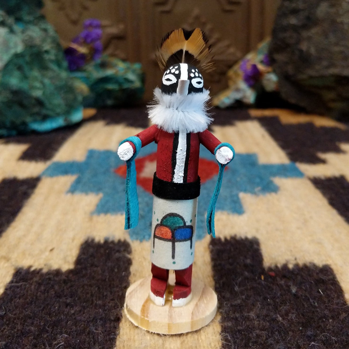 Mini Kokopelli kachina by Rosalind Grey with black-and-white face, white fur collar, feathered crest, and red body.