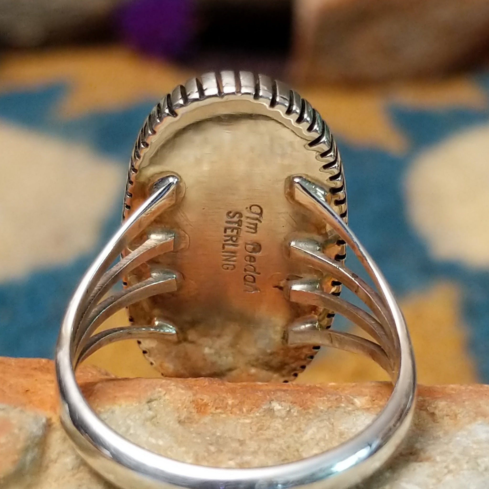 Sterling silver Lapis Lazuli ring by Tim Bedah featuring a capsule-shaped deep blue stone with natural pyrite inclusions; artisan and Sterling Silver stamp.