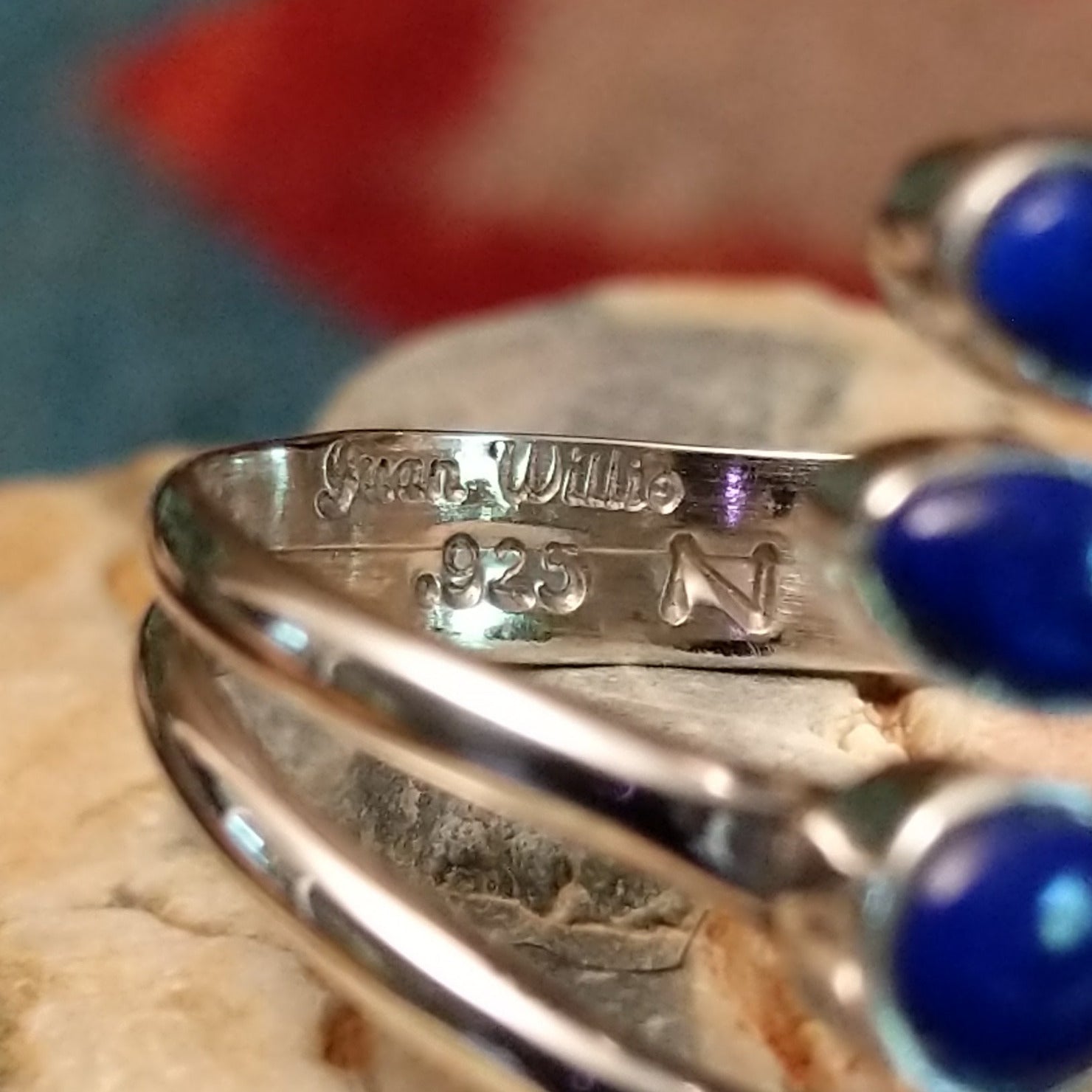 Close-up of the artisan's stamped signature.