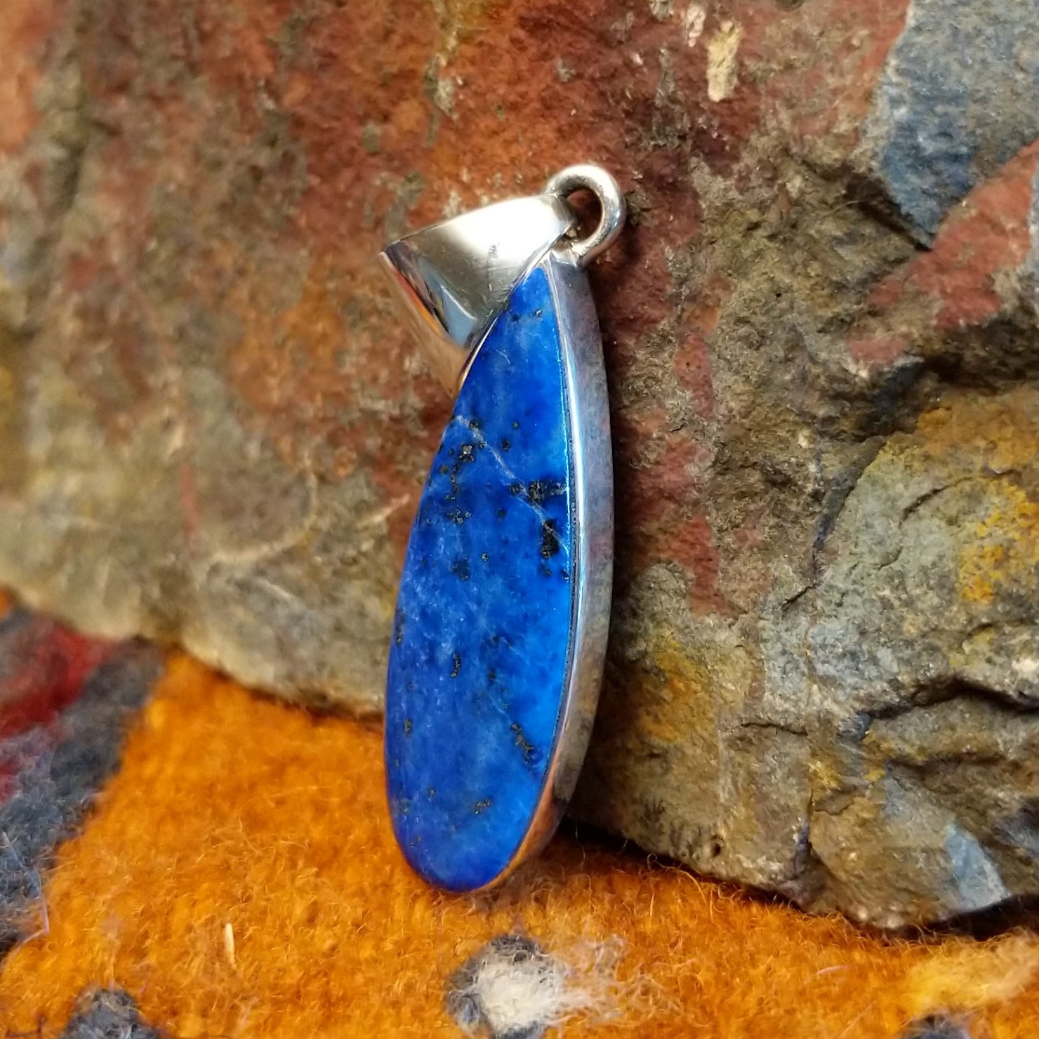 Sterling silver teardrop pendant with lapis set in the bezel.