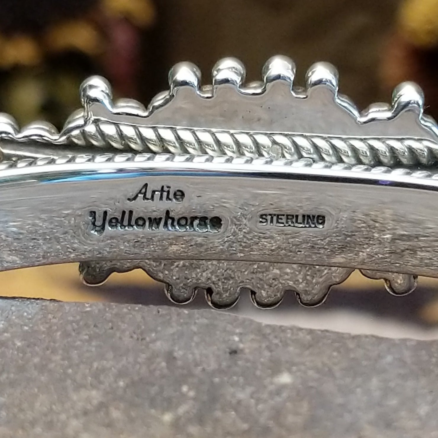 Close up of the artist's stamped signature.