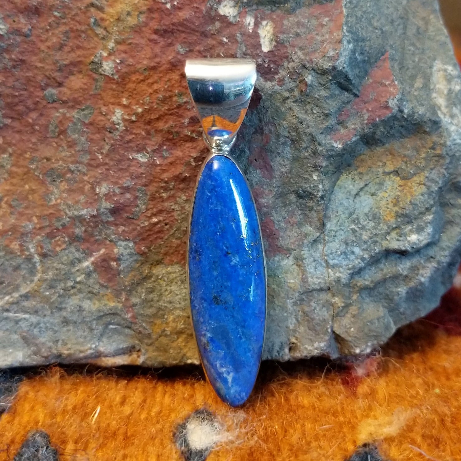 Sterling silver navette pendant with lapis set in the bezel.
