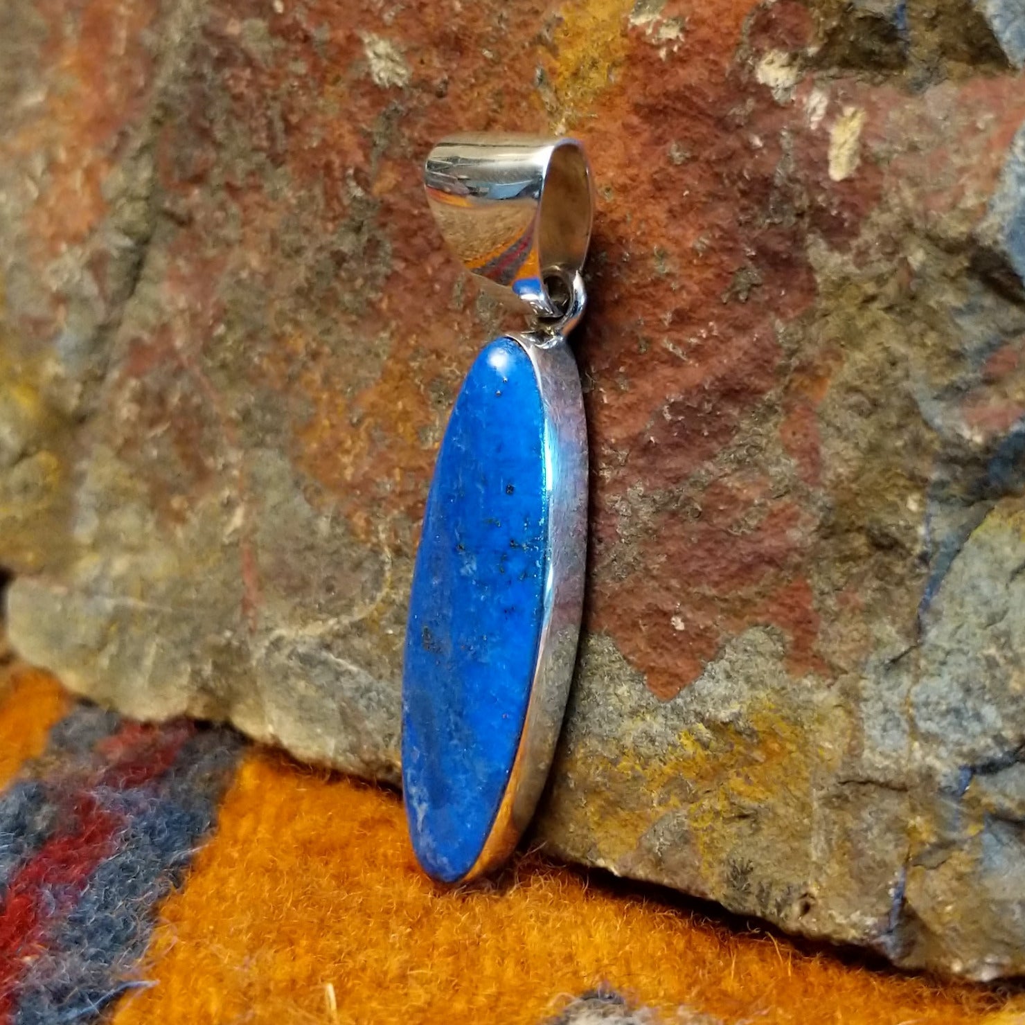 Sterling silver navette pendant with lapis set in the bezel.