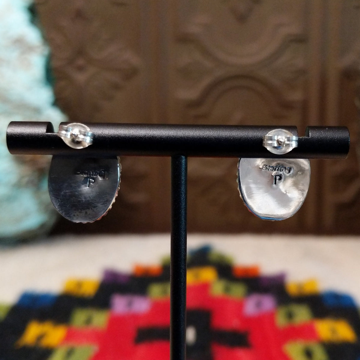 Lapis Oval Earrings by Priscilla Smith featuring deep blue oval lapis cabochons set in polished silver with twisted rope-style borders; artisan and Sterling Silver stamp.