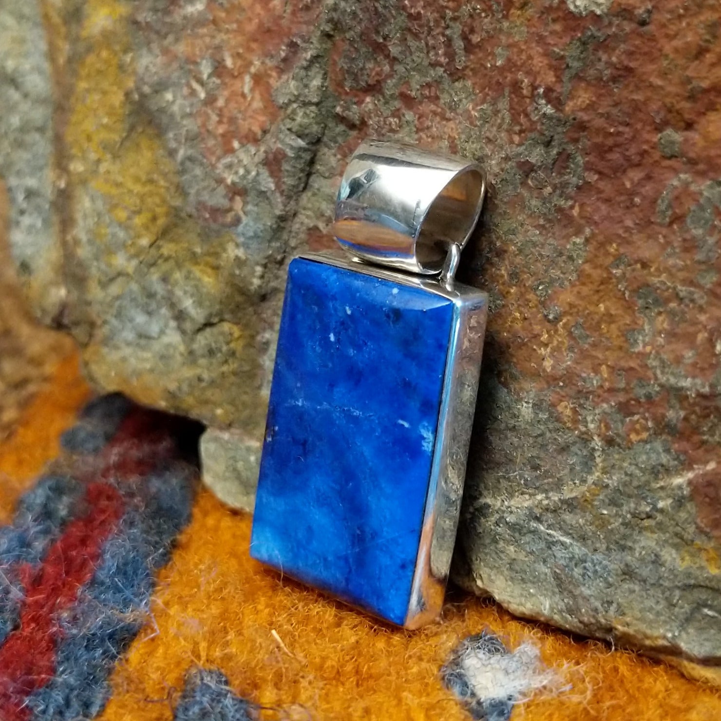 Rectangular sterling silver pendant with lapis set in the bezel.