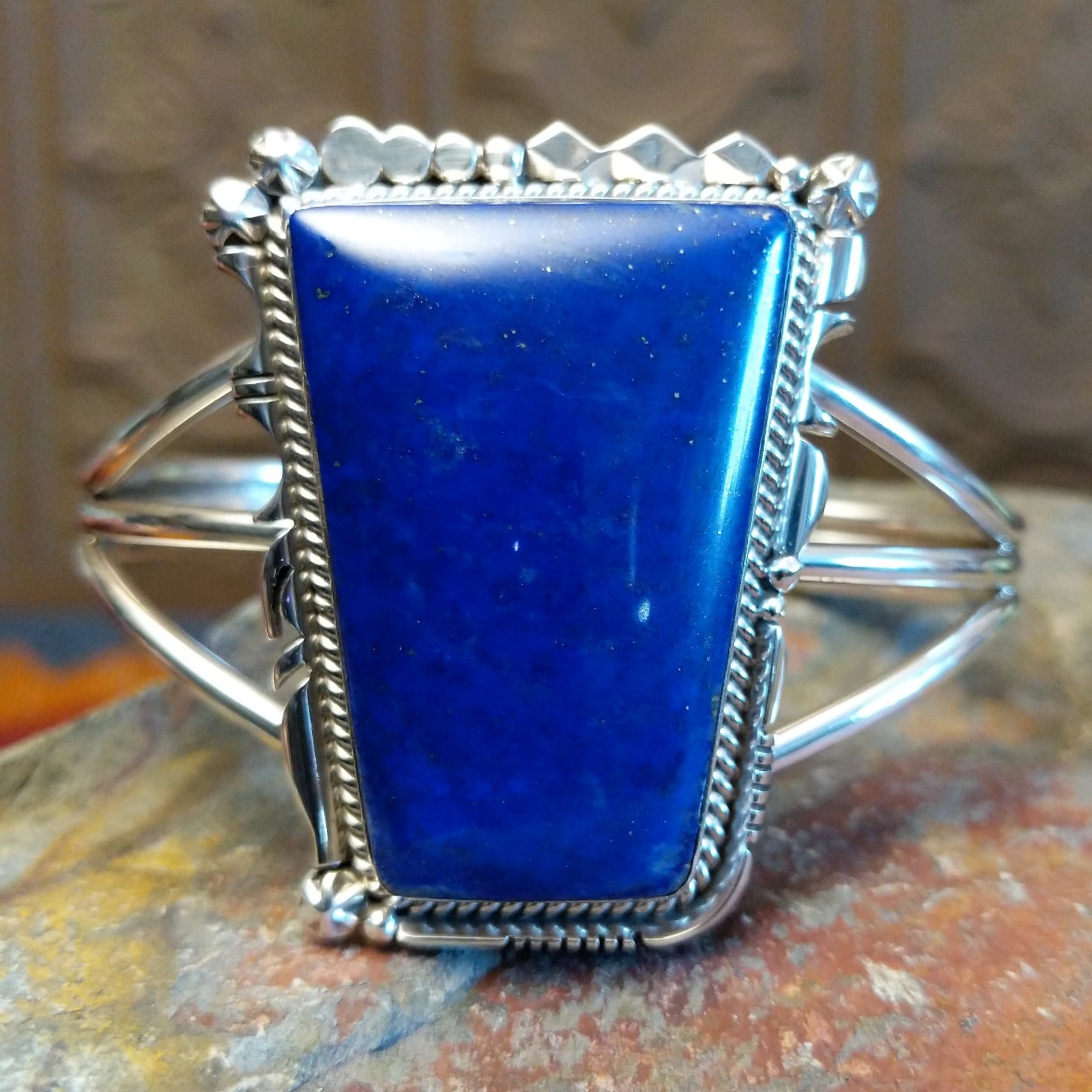 Sterling silver cuff bracelet with twisted rope and intricate silverwork.