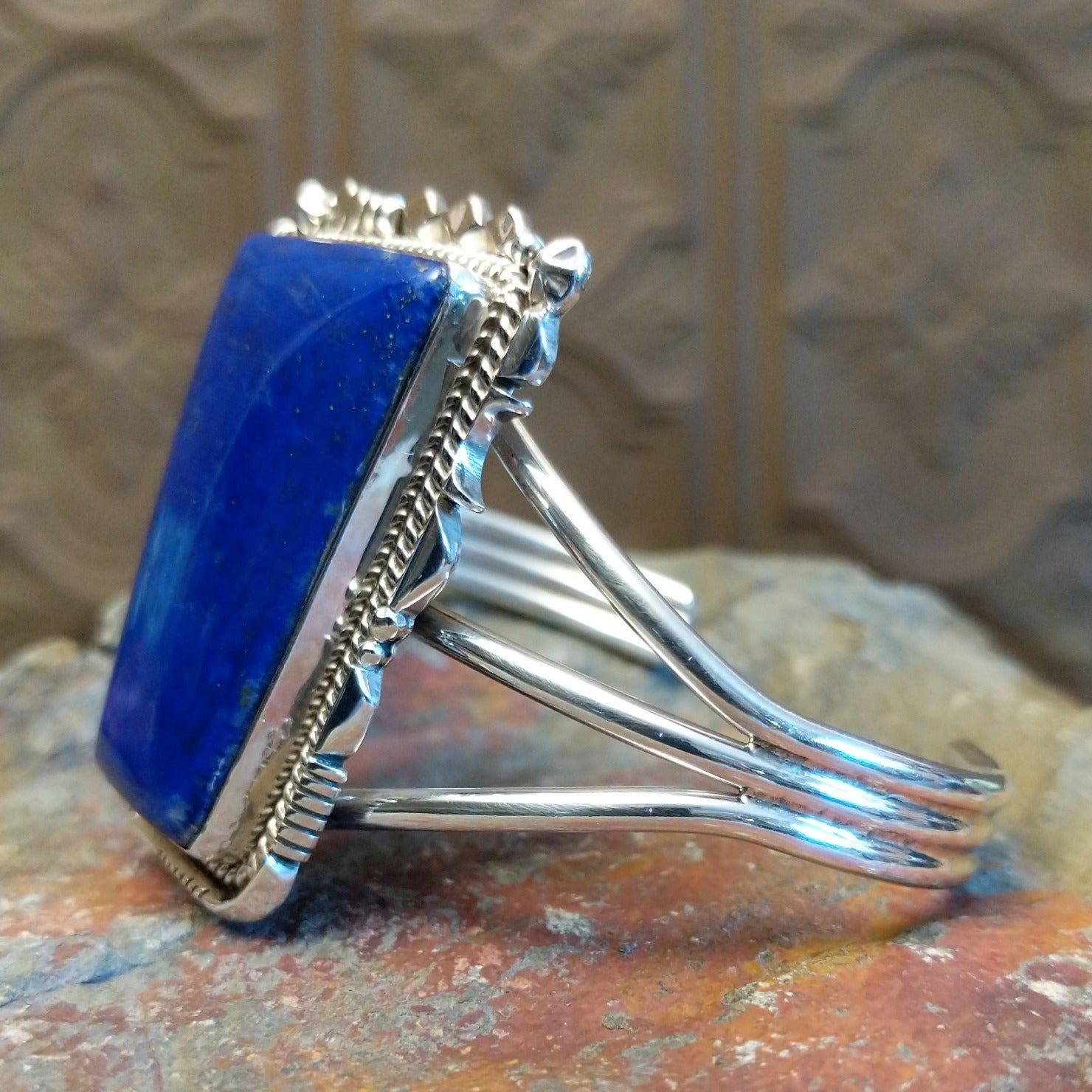 Sterling silver cuff bracelet with twisted rope and intricate silverwork.