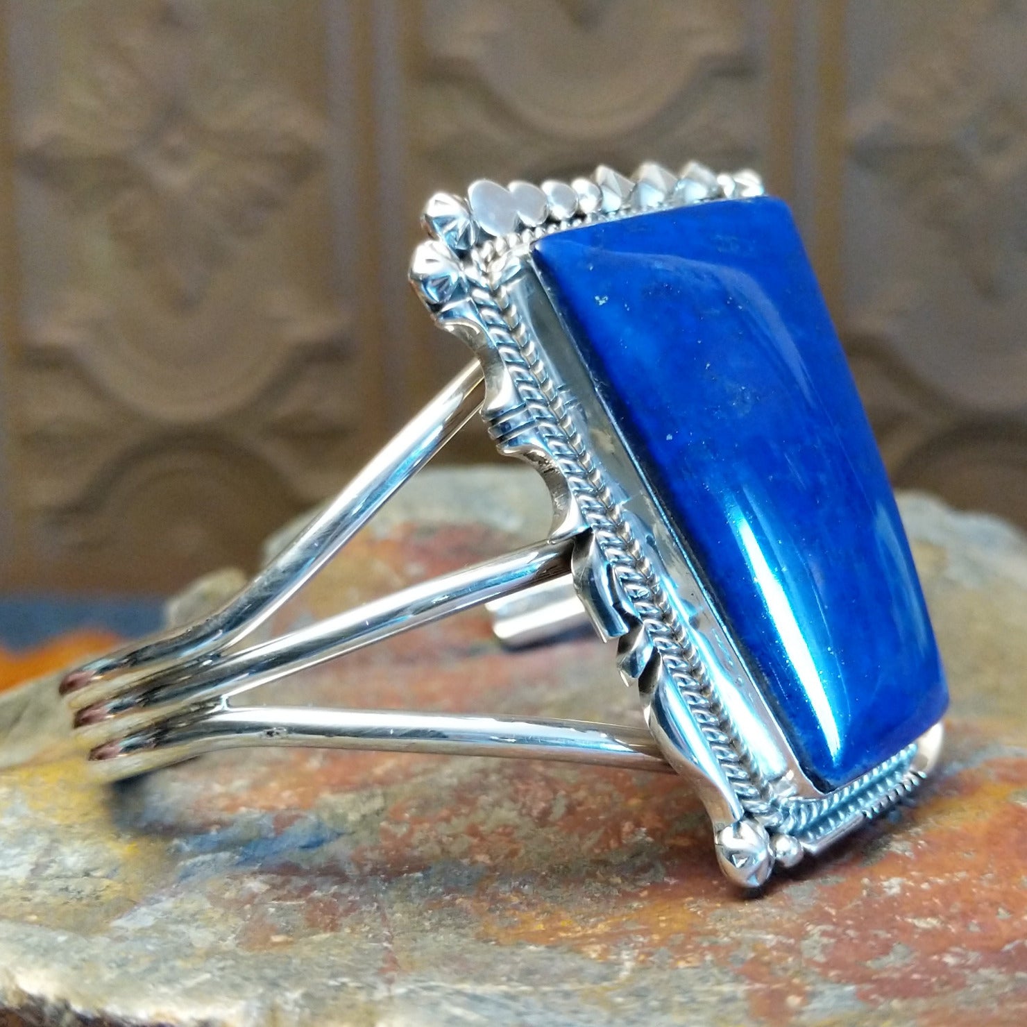 Sterling silver cuff bracelet with twisted rope and intricate silverwork.
