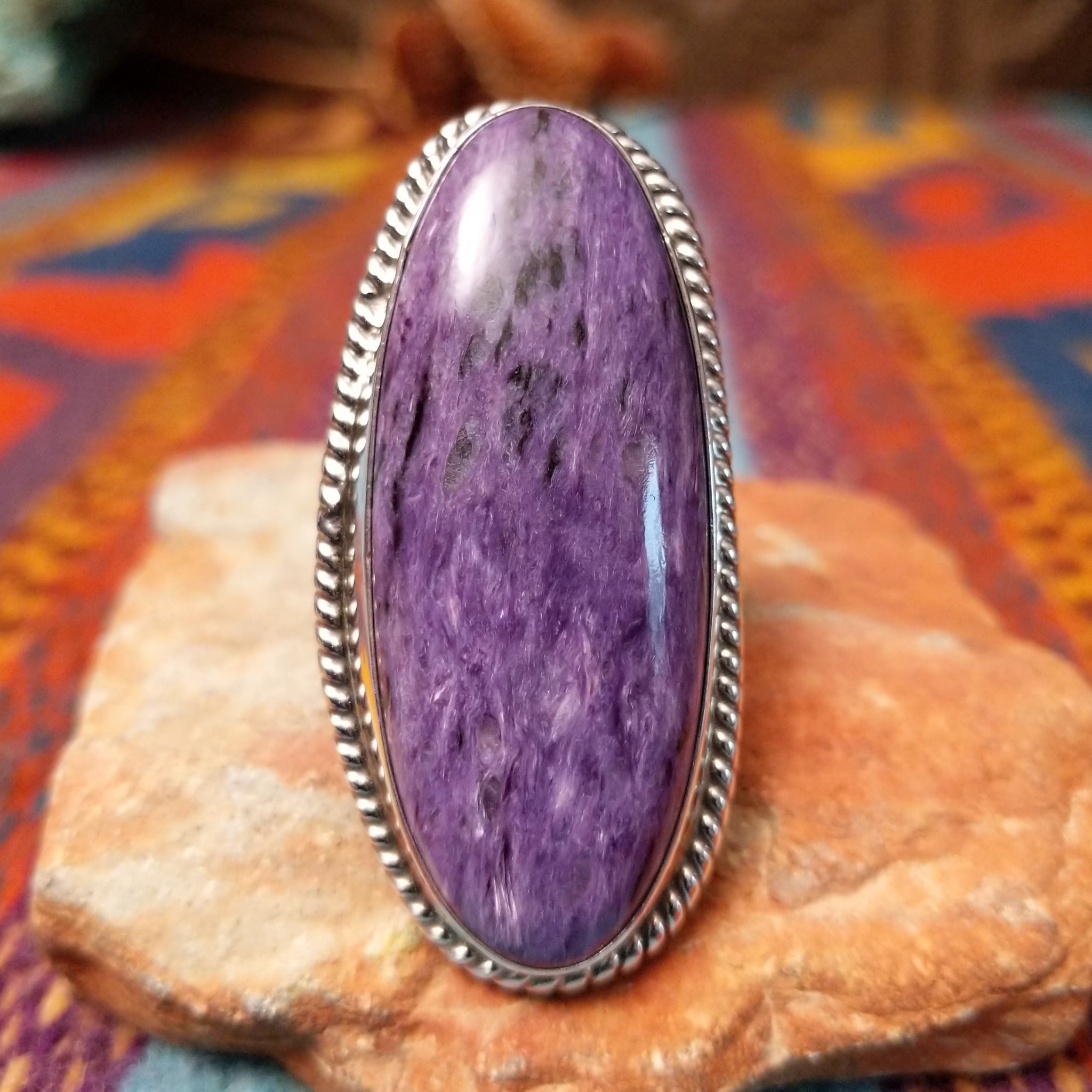Large Charoite Ring by Sharon Francisco featuring an elongated purple charoite stone with natural swirling patterns, framed by twisted rope detailing and set in Sterling Silver.
