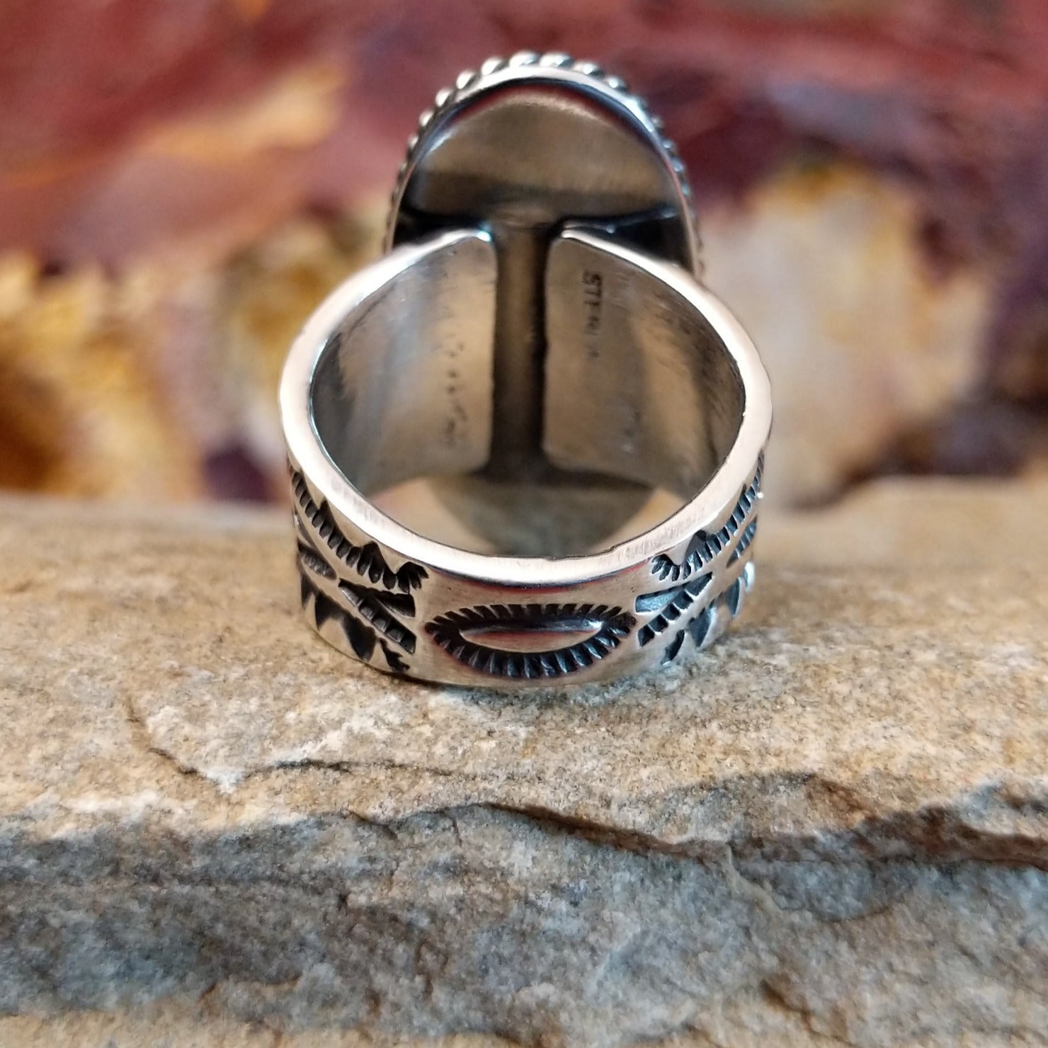 Intricate stamped designs on the silver band.
