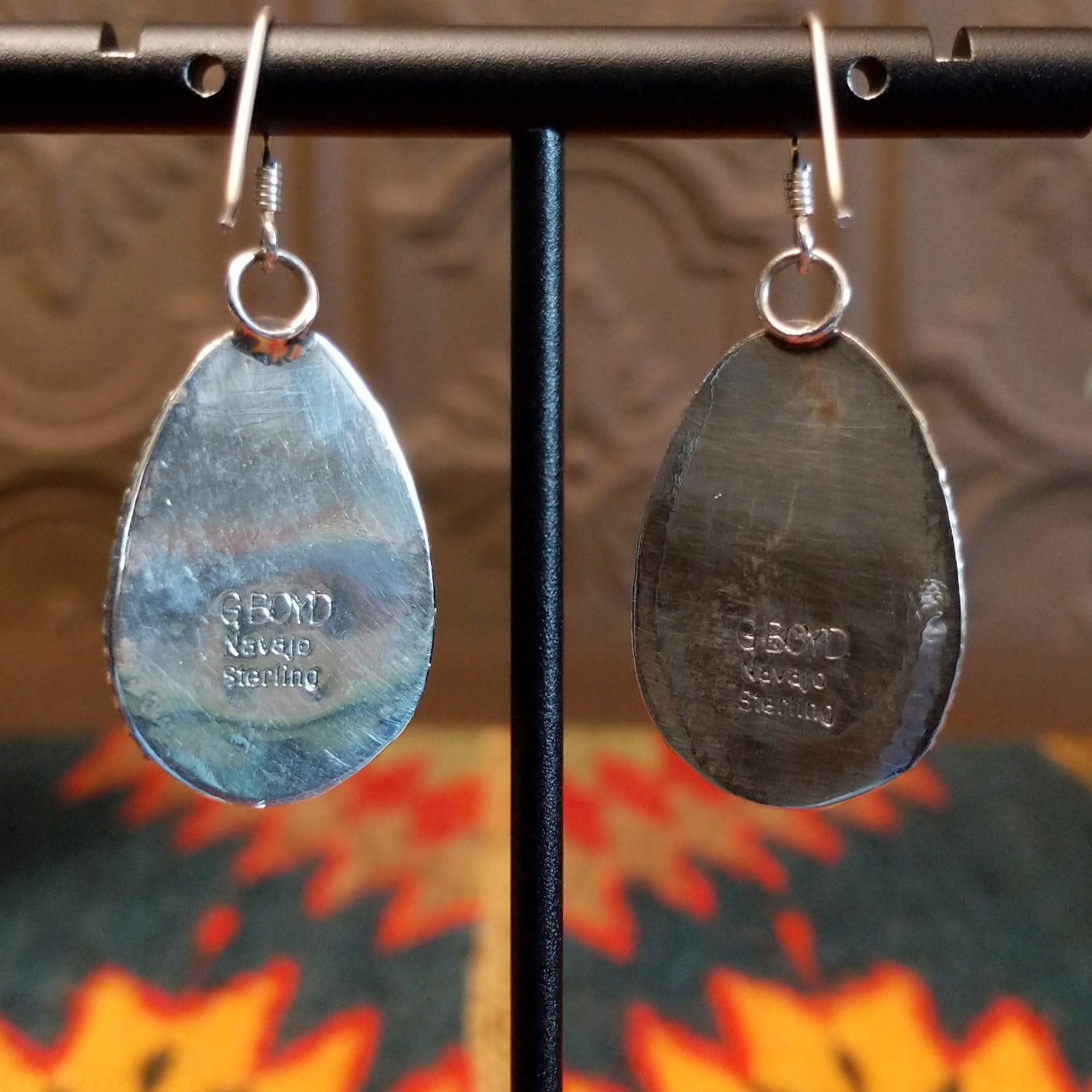 Close-up of the artisan's stamped signature.