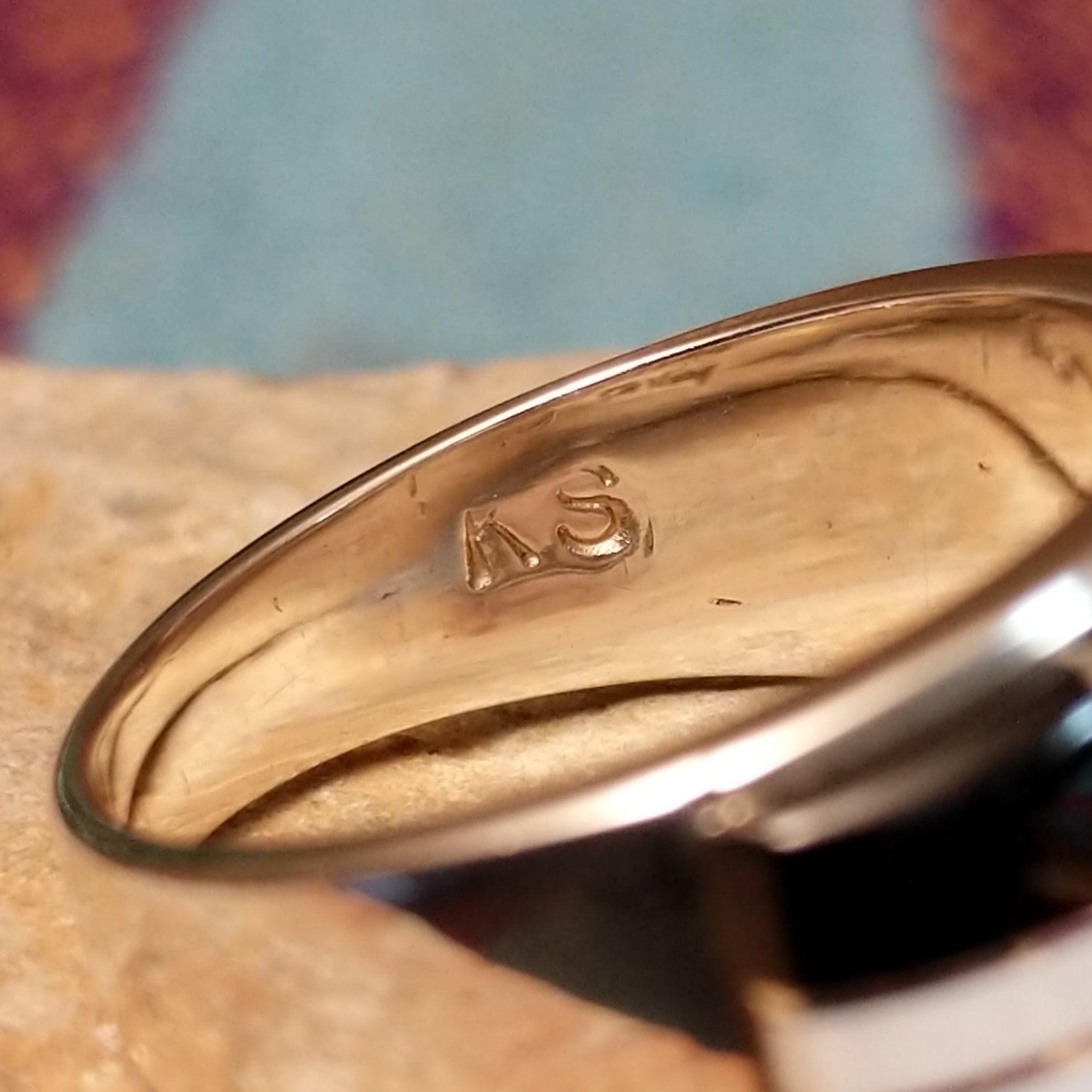 Magnesite & Black Onyx Ring by Karen Skeet featuring geometric white magnesite and black onyx inlay separated by fine silver channels across a wide polished silver band; artisan initials.