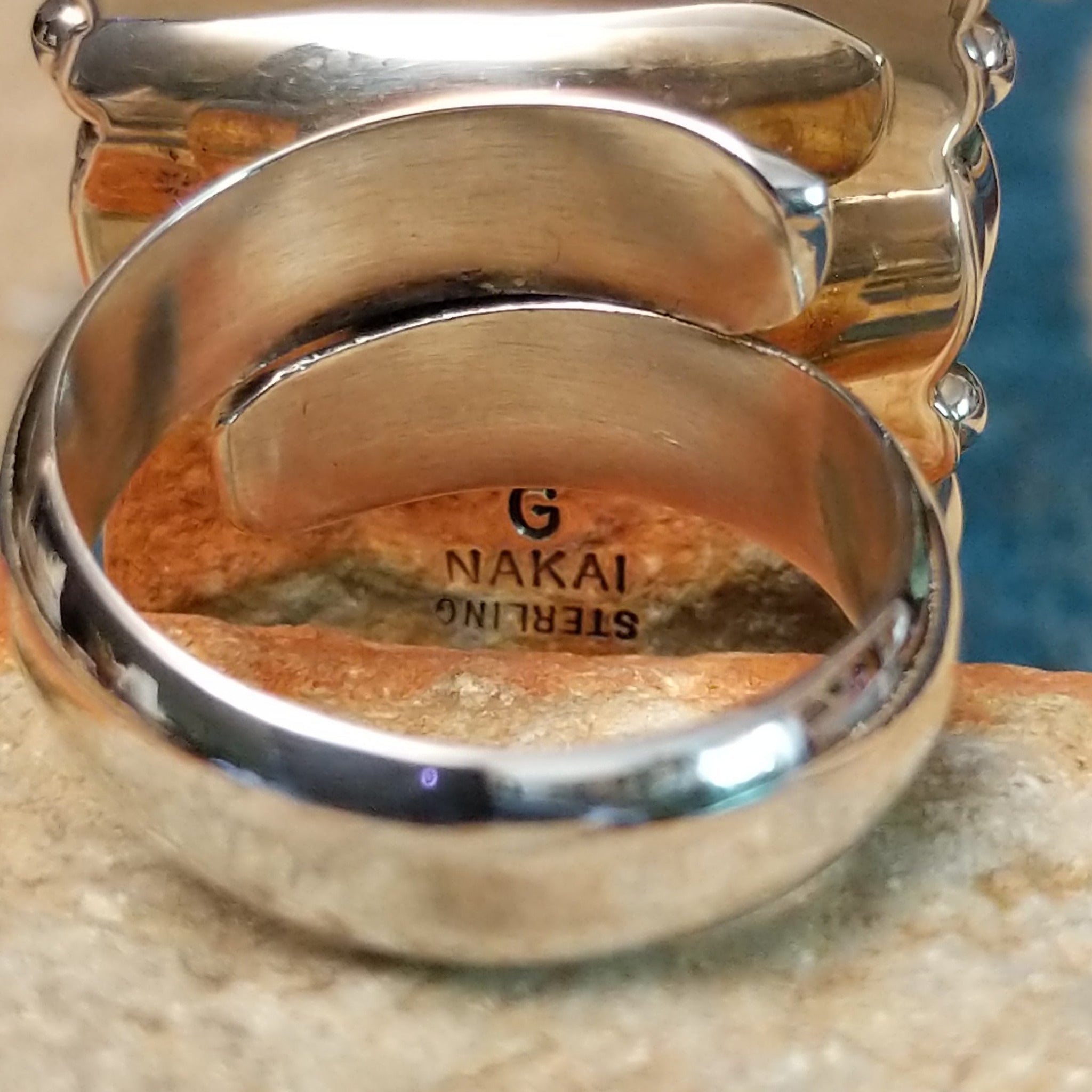 Handcrafted sterling silver malachite cluster ring by Gilo & Grace Nakai, featuring nine oval malachite gemstones with natural green banding; artisan and Sterling Silver stamp.