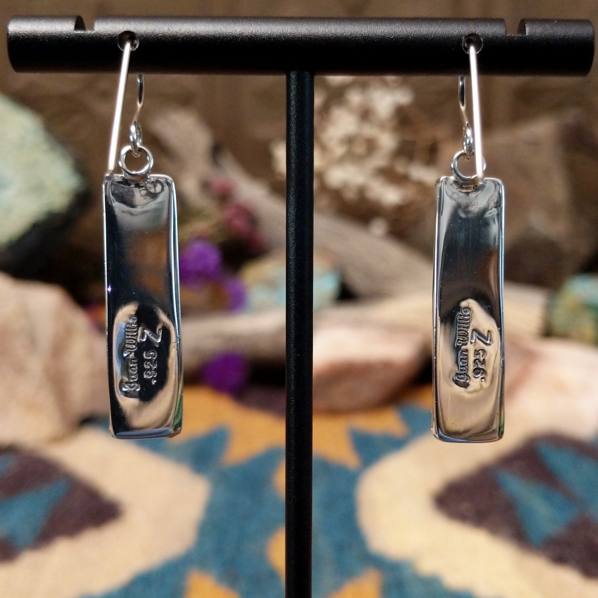 Handcrafted sterling silver pillar earrings by Juan Willie featuring rectangular natural malachite with vibrant green banding and French hook ear wires; artisan and Sterling Silver stamp.