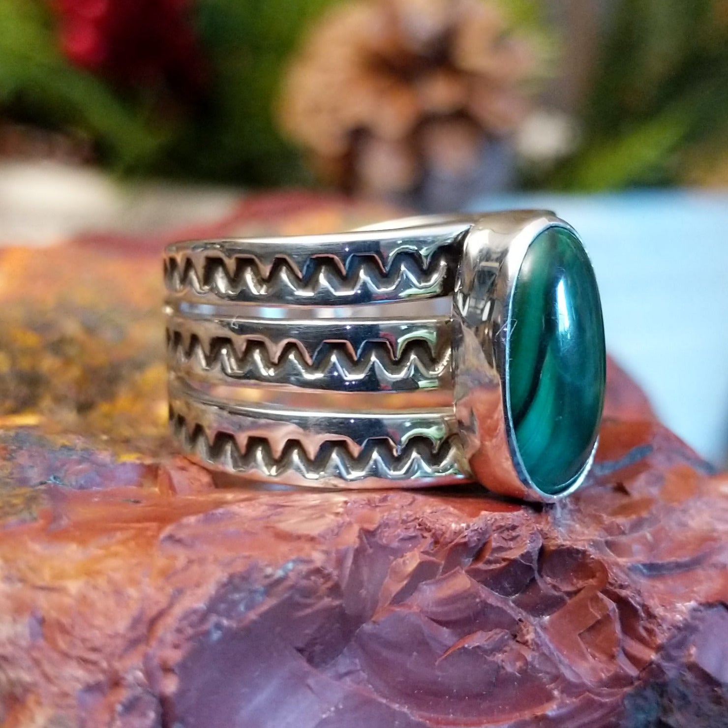 Sterling silver ring with tri-band and malachite centerpiece.