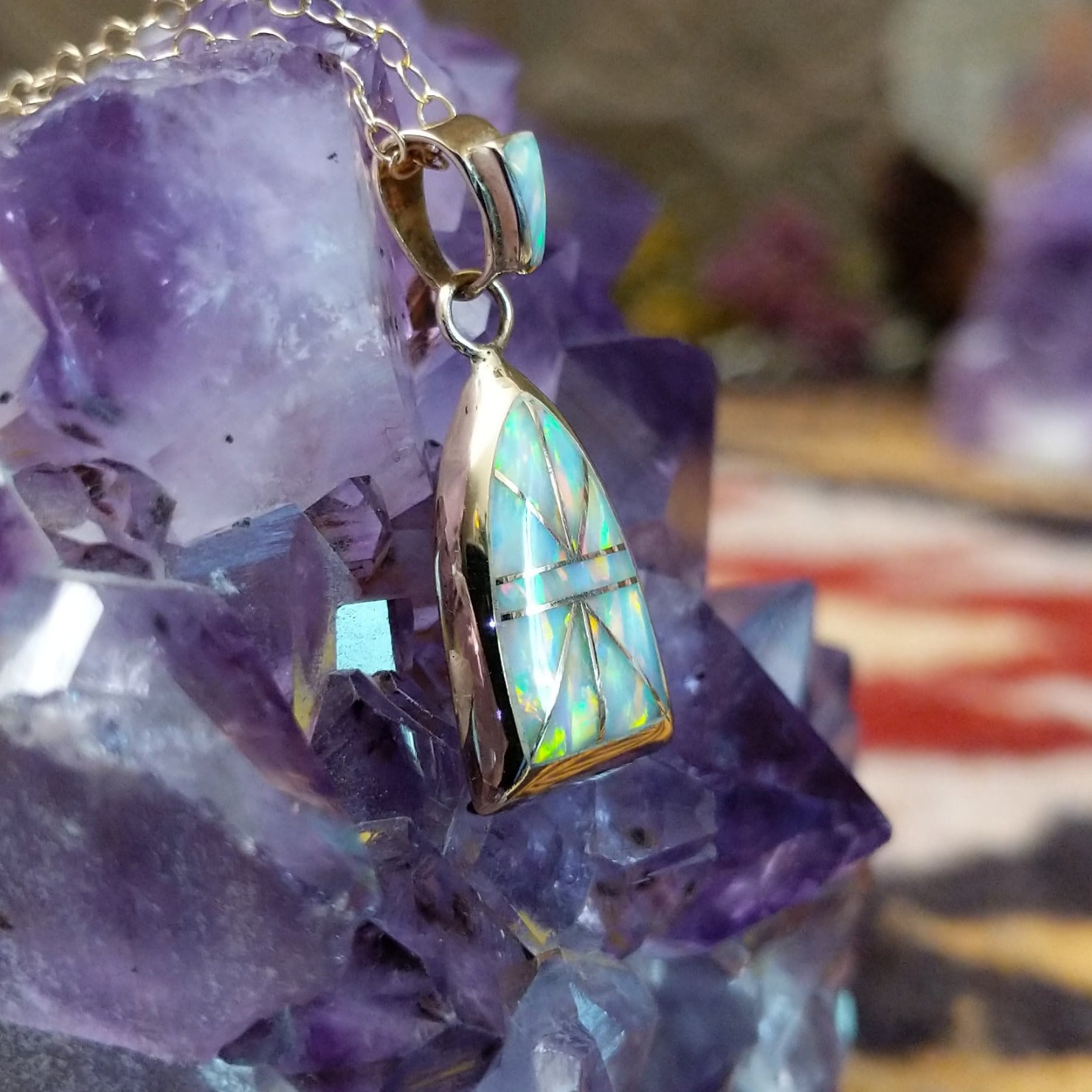14kt gold Donald Douglas arch pendant with geometric manmade opal inlay and opal bail.