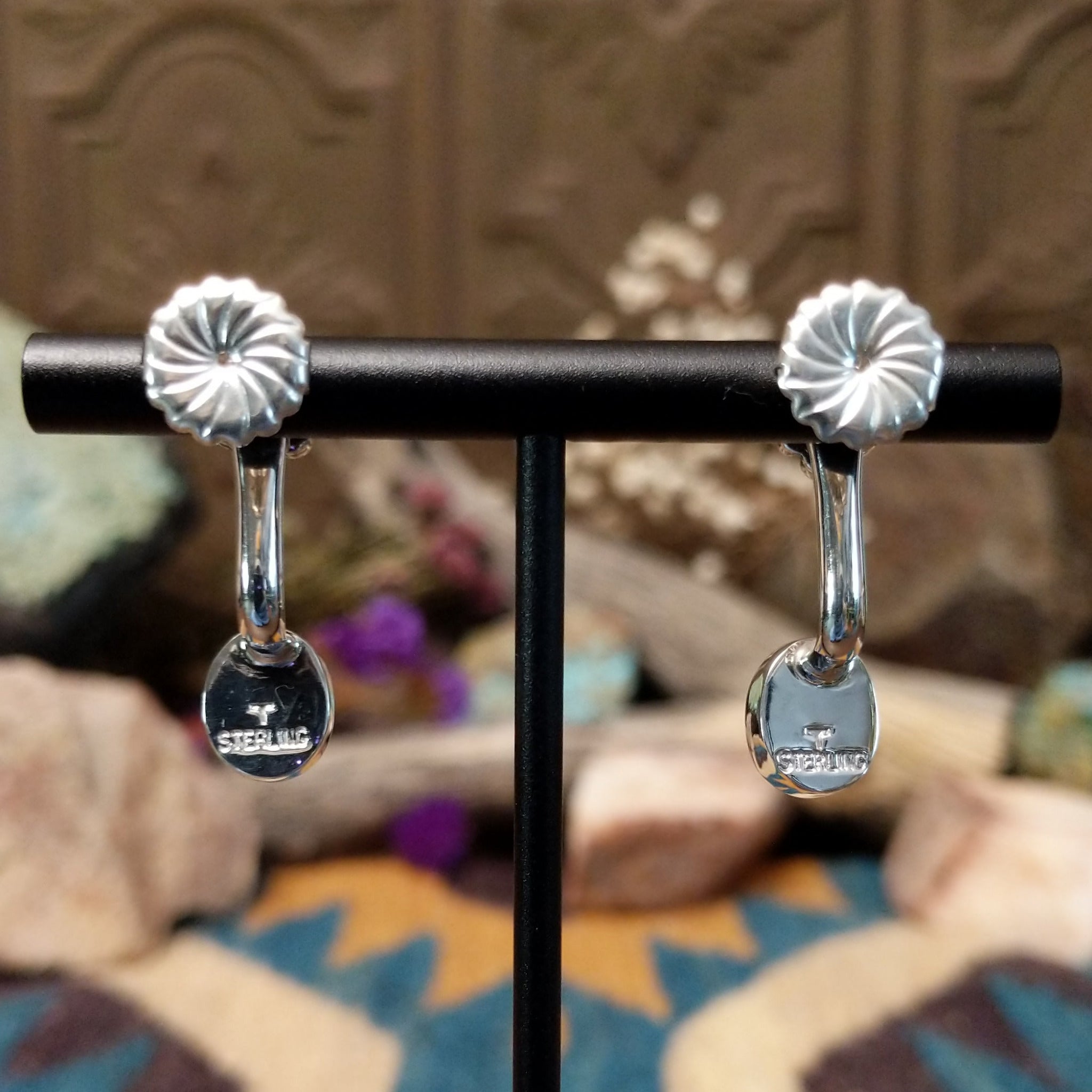 Handcrafted sterling silver adjustable earrings by Terry Wood featuring oval manmade opal cabochons with colorful iridescence and traditional Navajo silver bead cluster accents; artisan and Sterling Silver stamp.