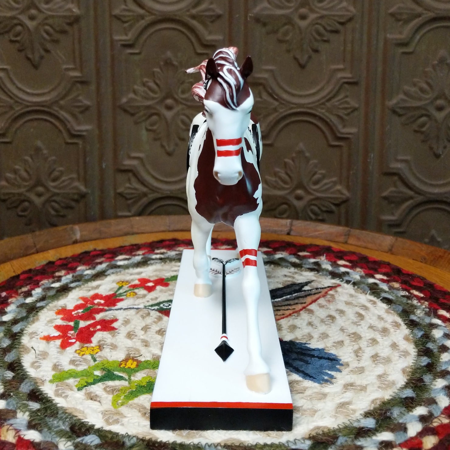 "Medicine Hat" collectible pony by The Trail of Painted Ponies, featuring intricate hand-painted designs, vibrant colors, and traditional Western-inspired artwork. Front view.