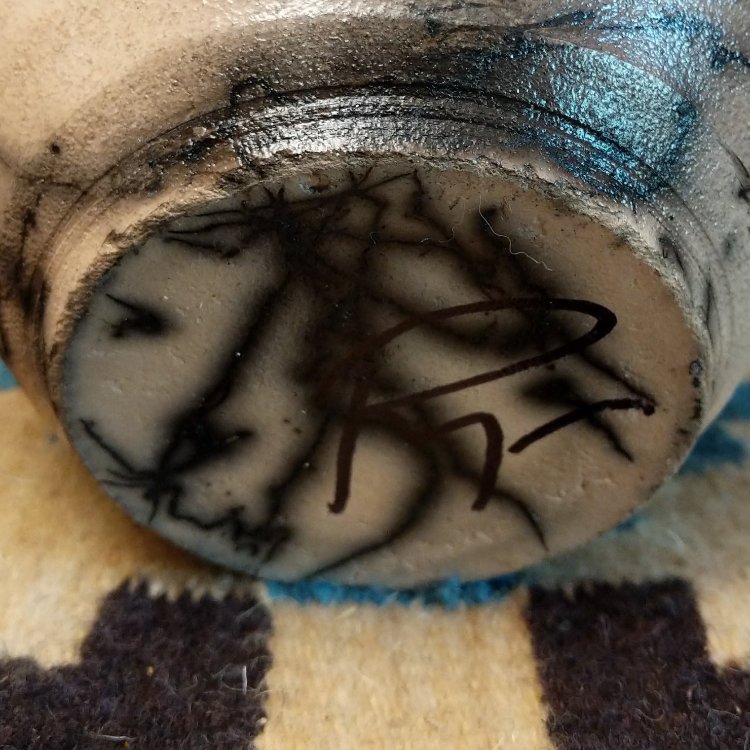 Close-up of the artisan's signature.