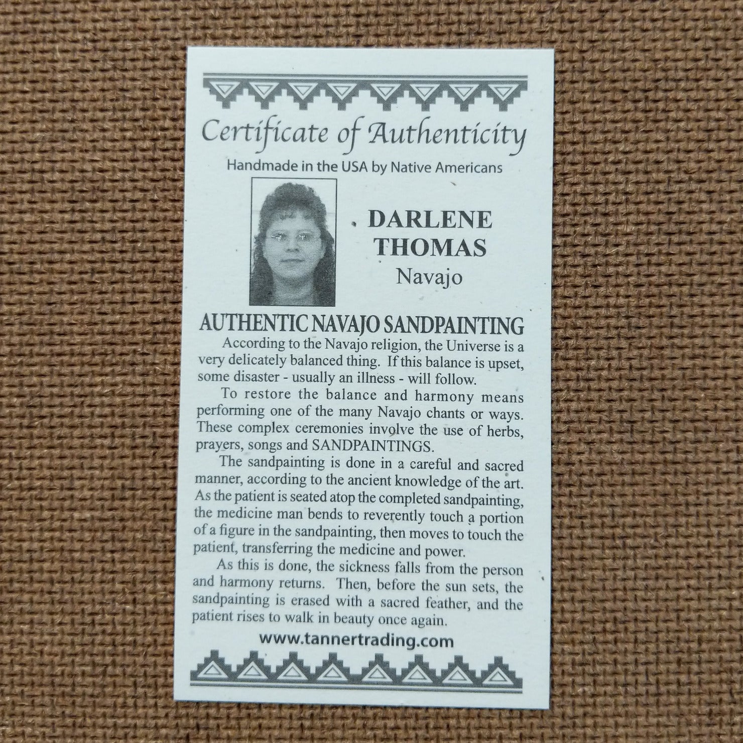 Close up of the Certificate of Authenticity and Artist information.