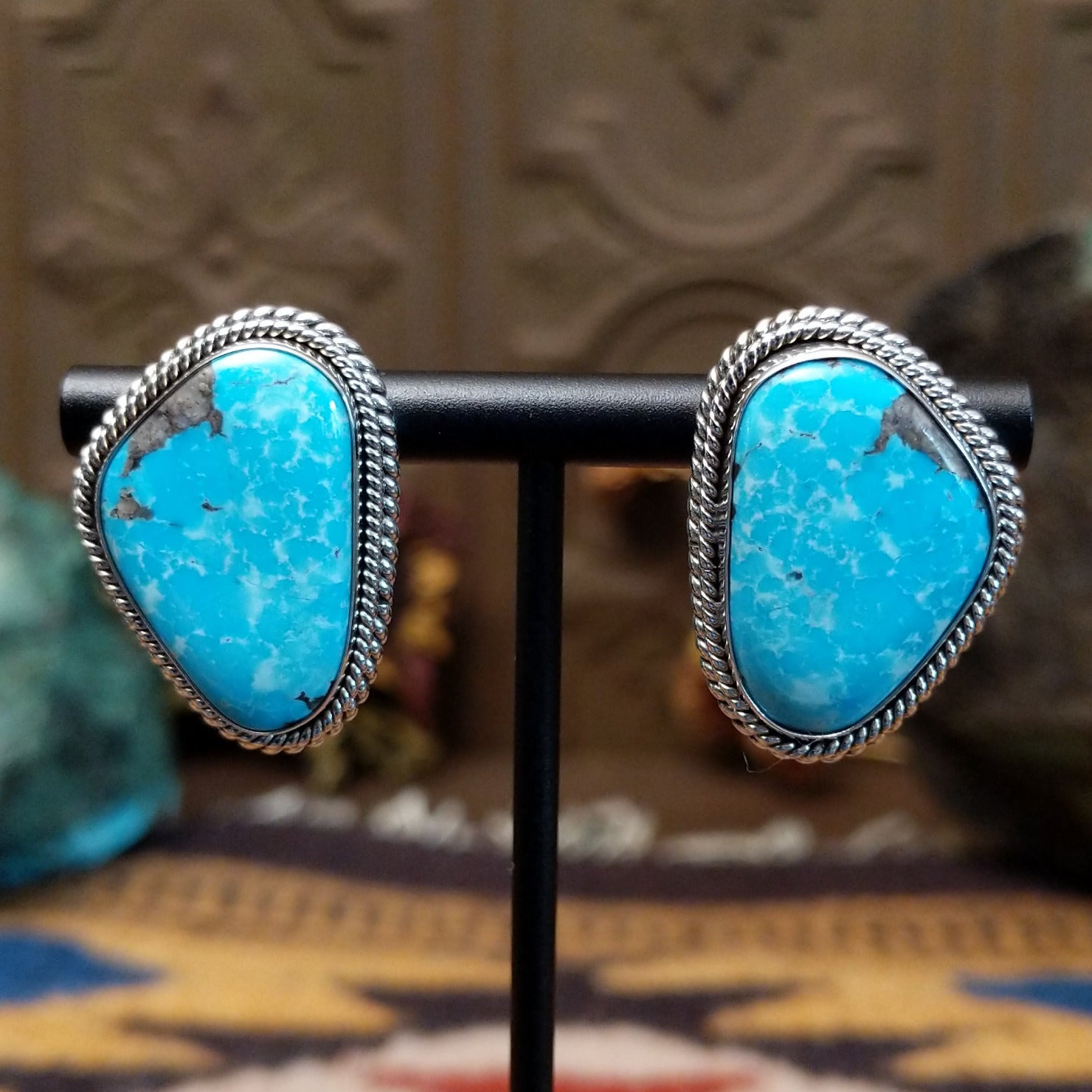 Sterling silver Morenci Turquoise stud earrings featuring freeform blue stones with natural matrix and twisted rope detailing.