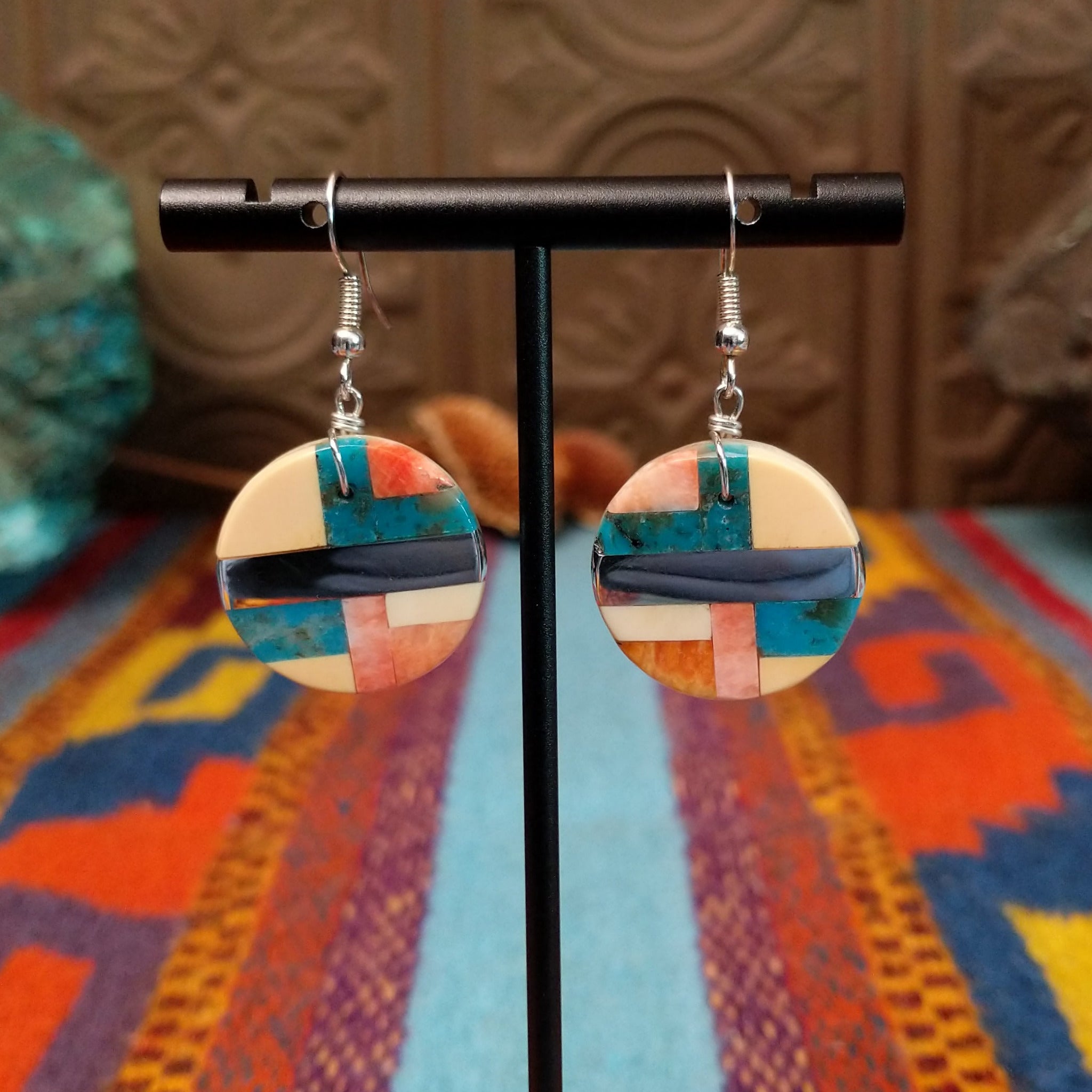 Multistone Circle Earrings by A. Medina with geometric stone and shell mosaic inlay.