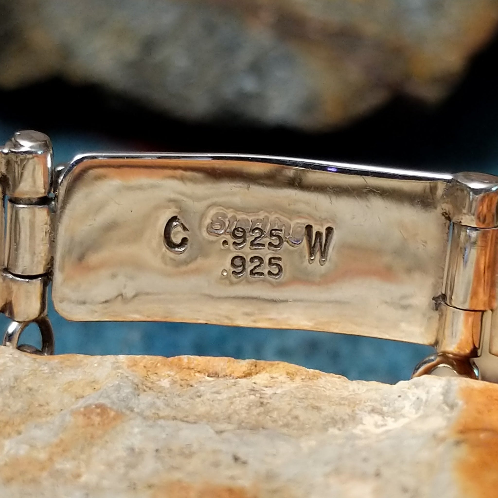 Sterling silver multistone inlay link bracelet by Cooper Willie with colorful Southwestern stone inlay; artisan and Sterling Silver stamp.
