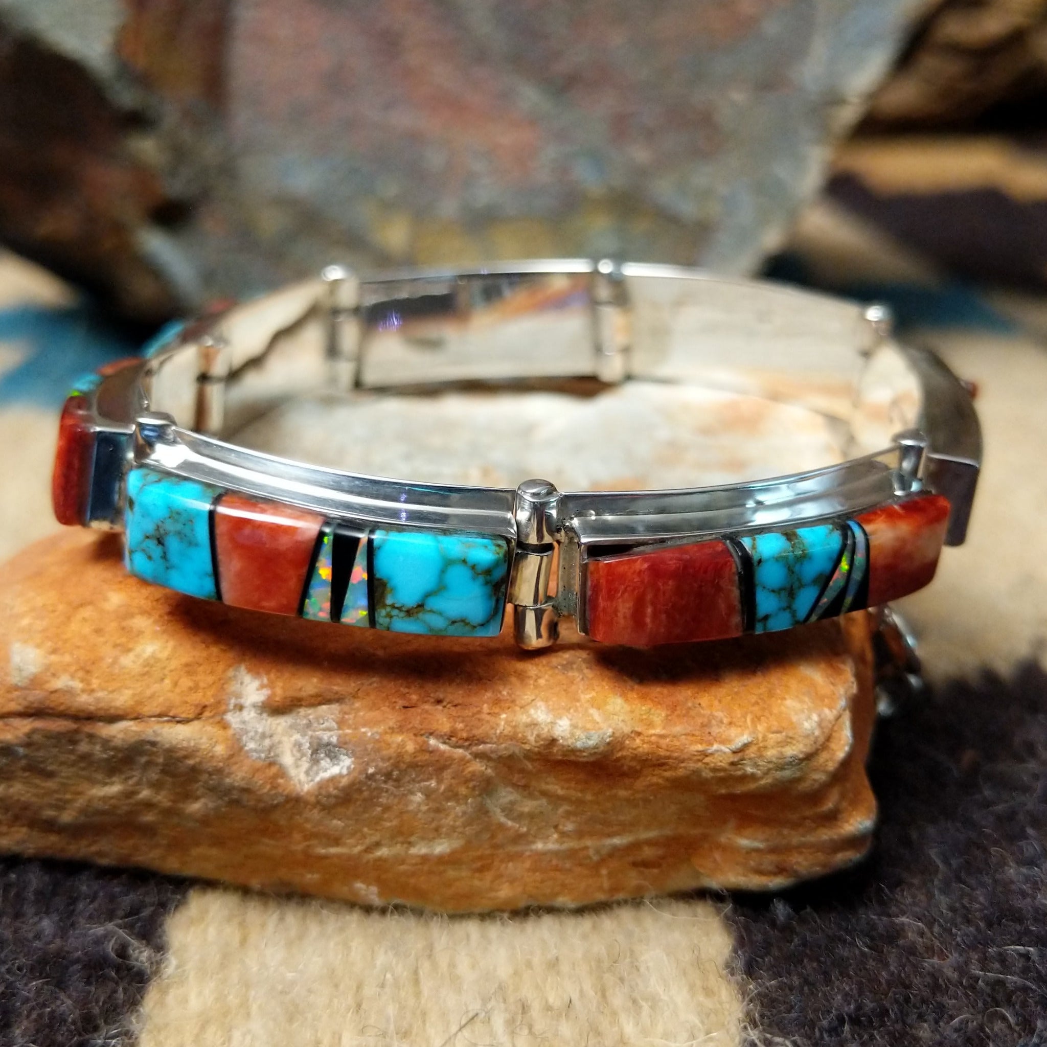 Sterling silver multistone inlay link bracelet by Cooper Willie with colorful Southwestern stone inlay.