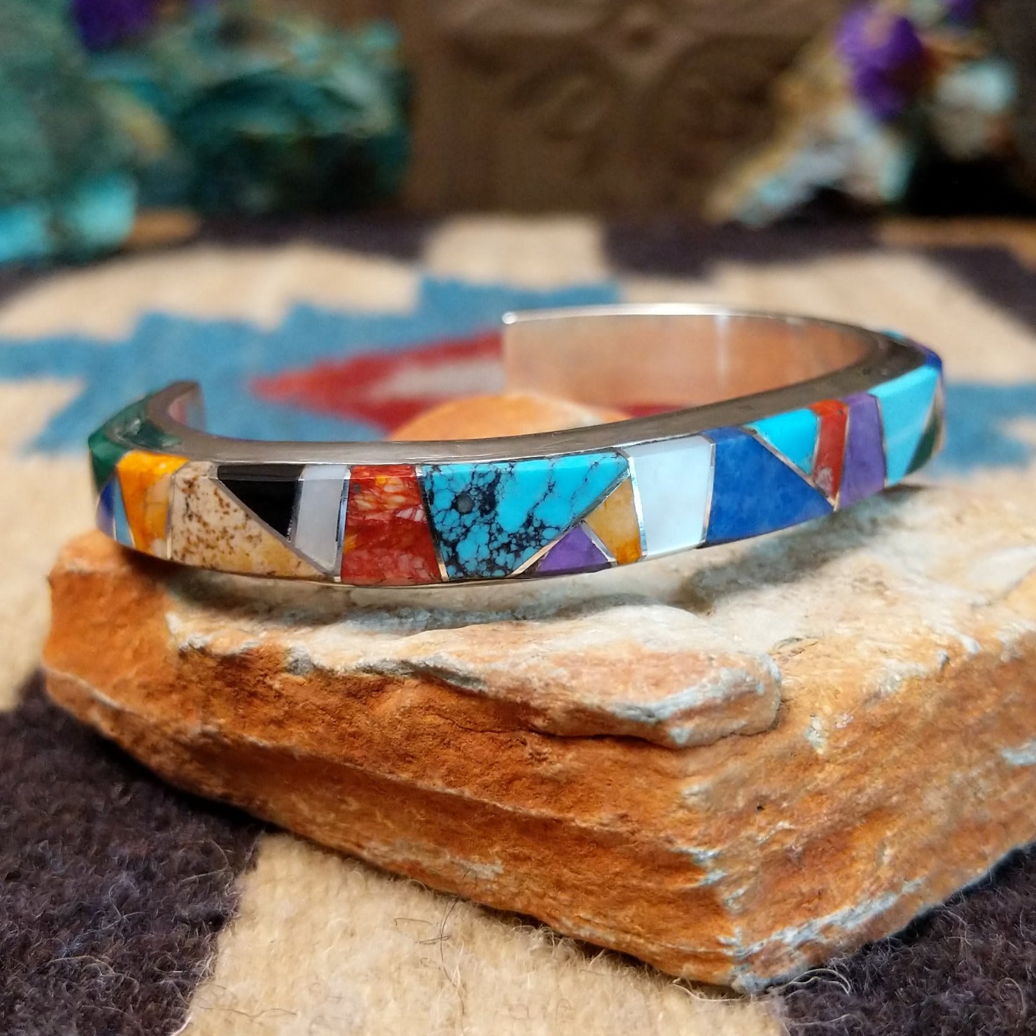 Multistone Medley cuff by Elsie Yellowhorse, featuring a colorful arrangement of natural stones set in handcrafted Southwestern-inspired metalwork.