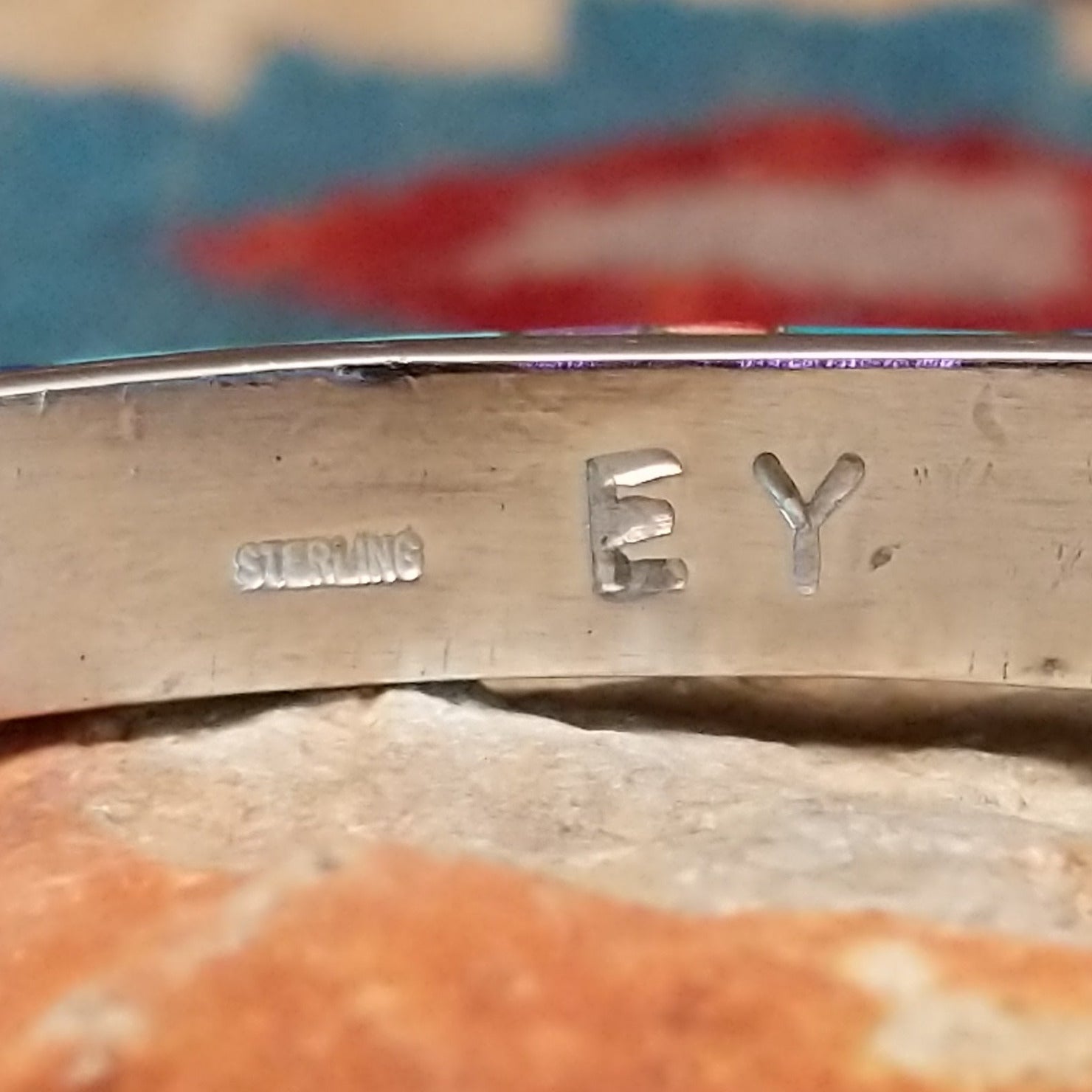 Multistone Medley cuff by Elsie Yellowhorse, featuring a colorful arrangement of natural stones set in handcrafted Southwestern-inspired metalwork. Artisan and Sterling Silver stamp.