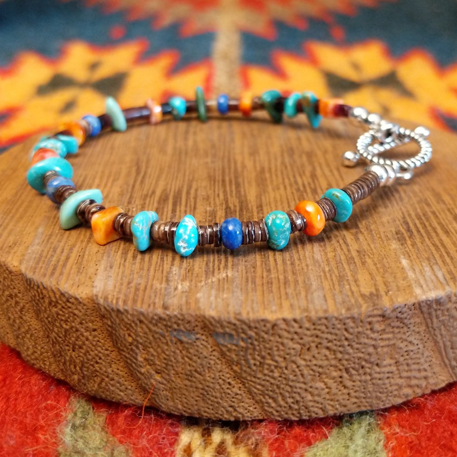 Sterling silver bracelet with beaded turquoise, orange spiny oyster shell, and pen shell.