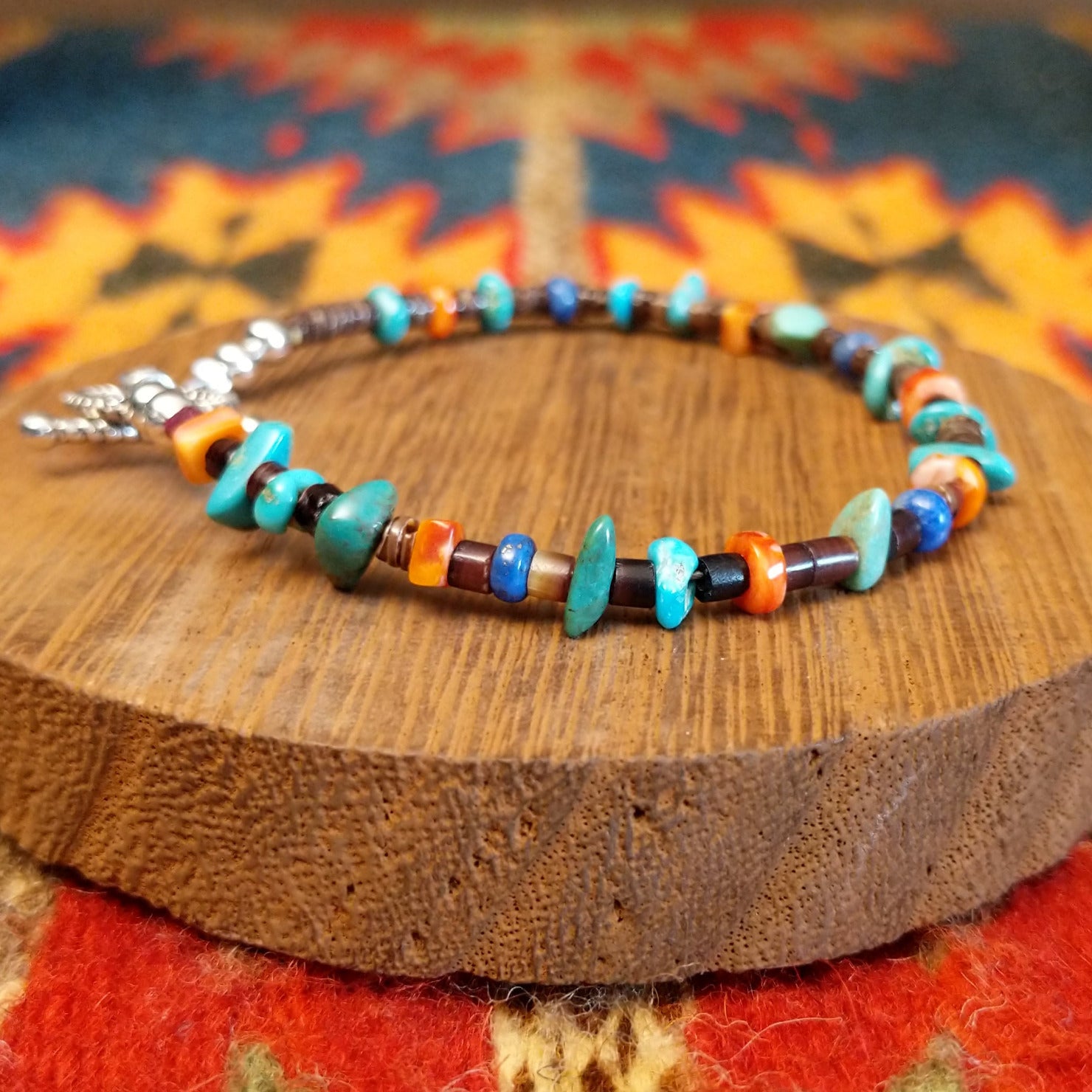 Sterling silver bracelet with beaded turquoise, orange spiny oyster shell, and pen shell.