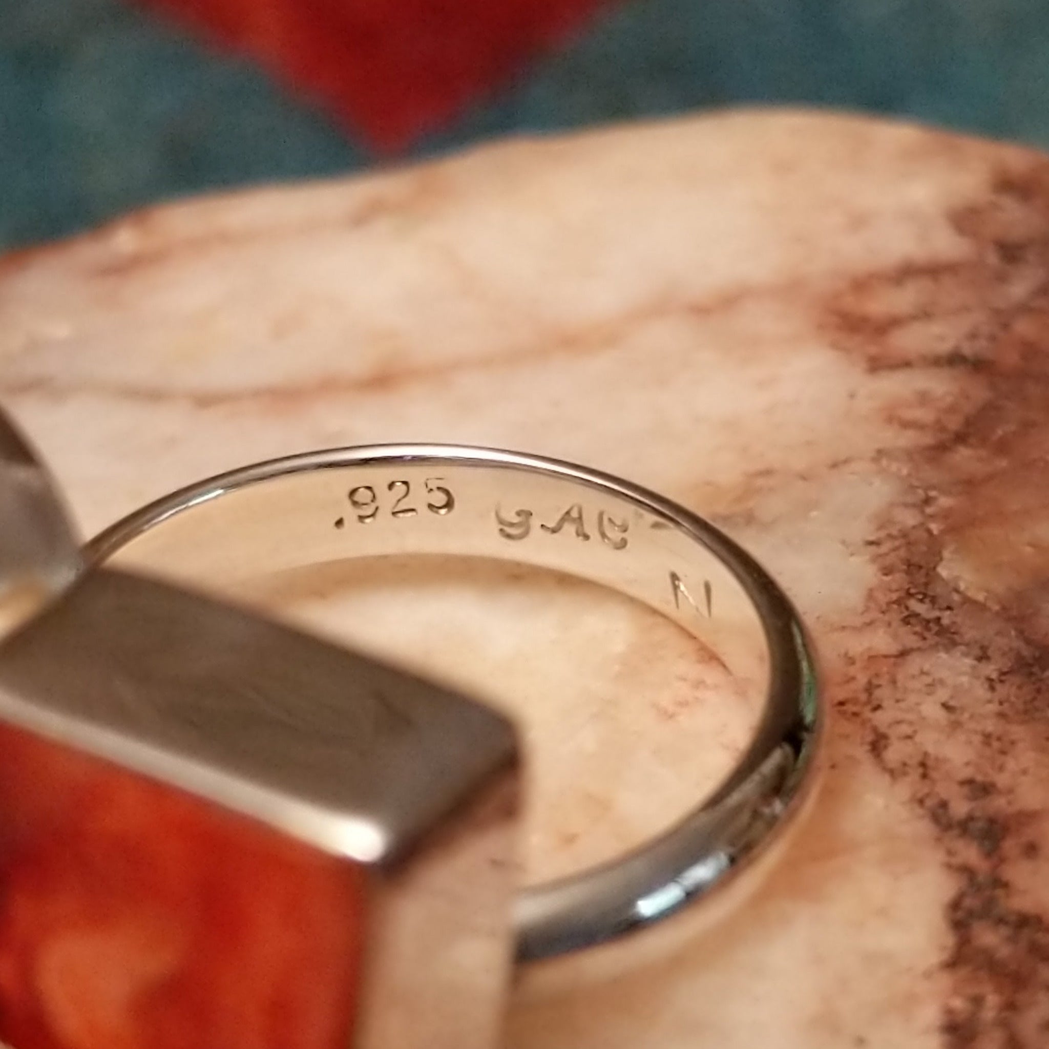 Multistone trio ring by Ann Curley, featuring blue lapis, green turquoise, and red spiny oyster shell set in a handcrafted sterling silver ring with a contemporary design. Artisan and Sterling Silver stamp.