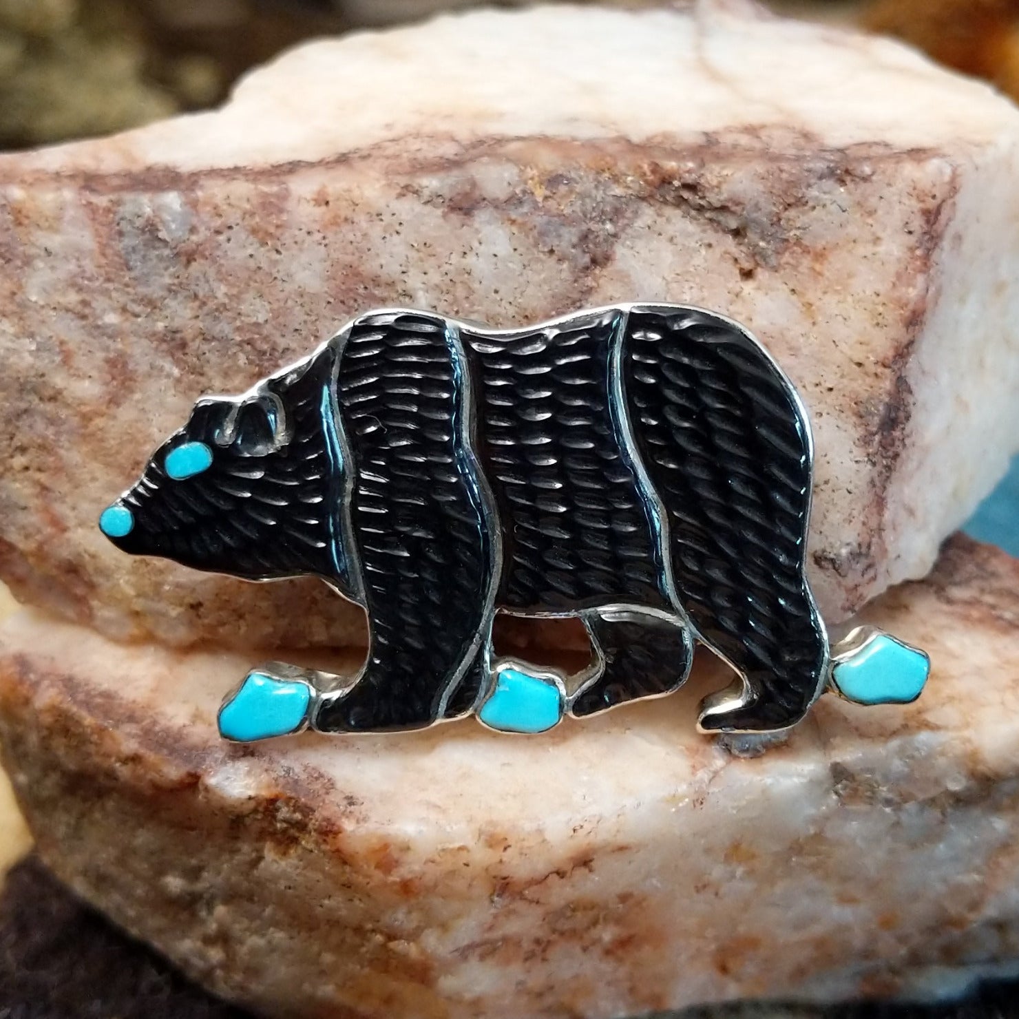 Sterling silver bear pendant with black onyx and turquoise set in the bezel.