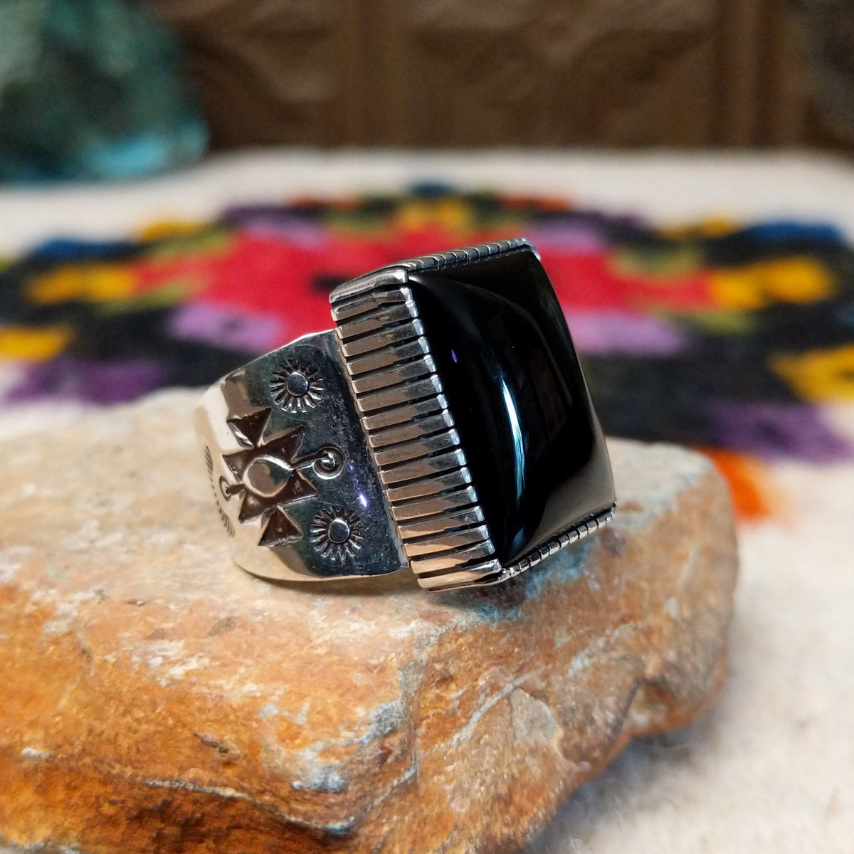 Navajo black onyx ring by J.P.J. with stamped silver band.