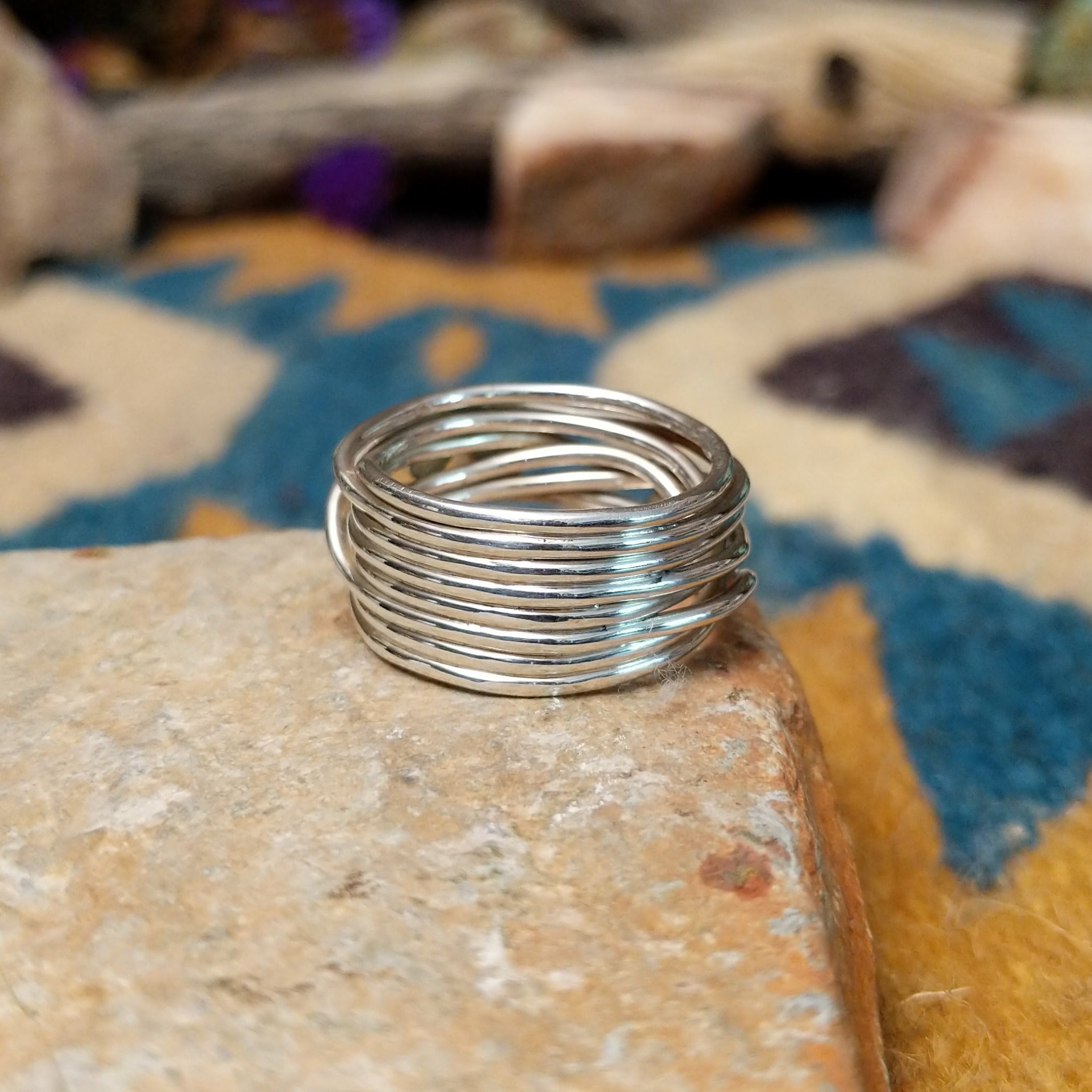 Navajo sterling silver multi-strand ring with polished Black Onyx cabochons; underside view.