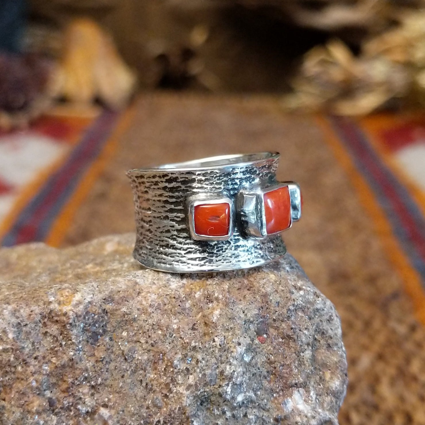 Sterling silver ring with coral set in square bezels.