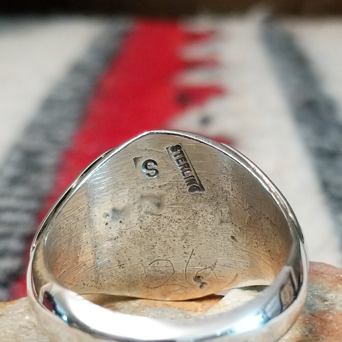 Close up of the artist's stamped signature