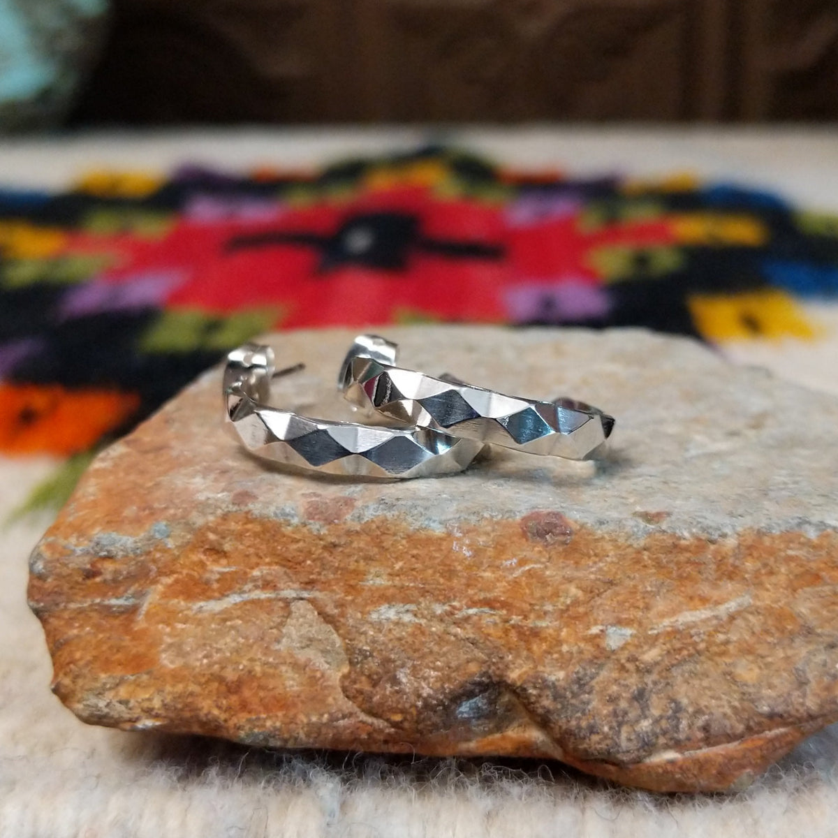Navajo faceted silver hoop earrings.