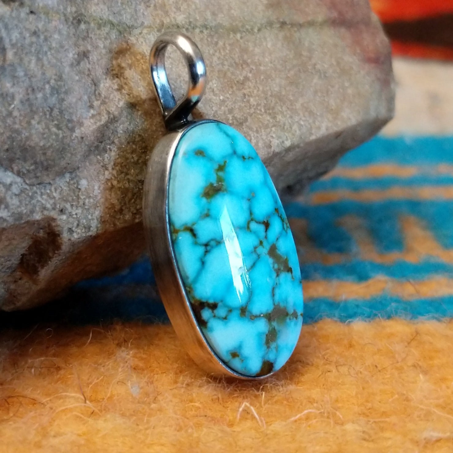 Sterling silver pendant with Kingman turquoise set in the oval bezel.