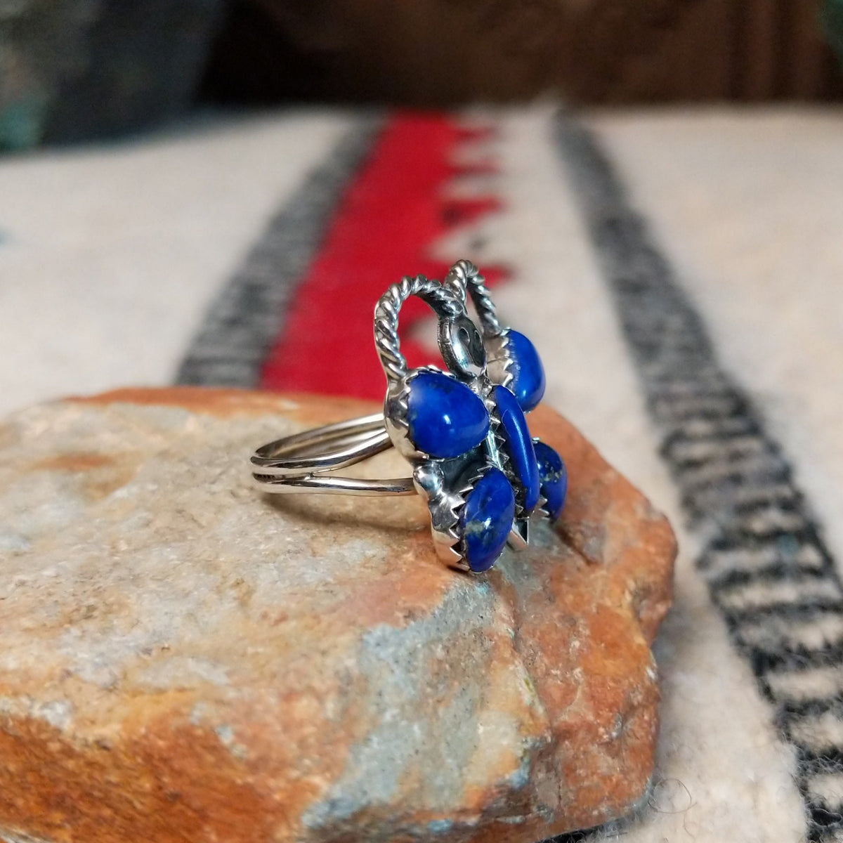 Navajo lapis butterfly ring by P.W. with twisted silver wire antennae.