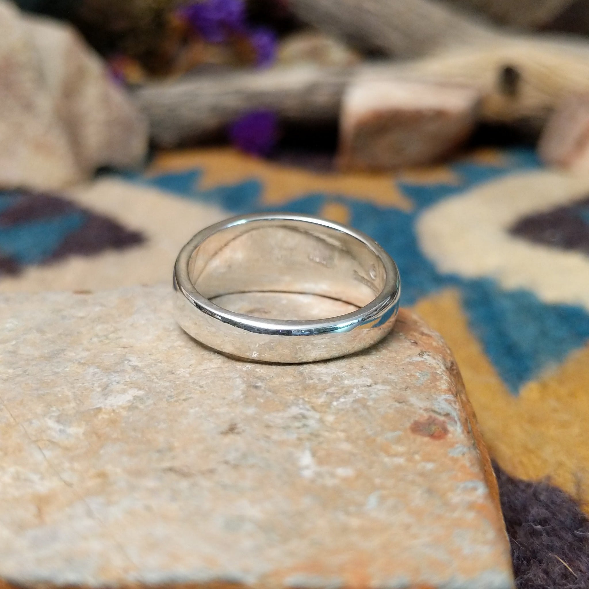 Sterling silver Navajo inlay ring with Lapis Lazuli, Turquoise, and geometric accents; underside view.
