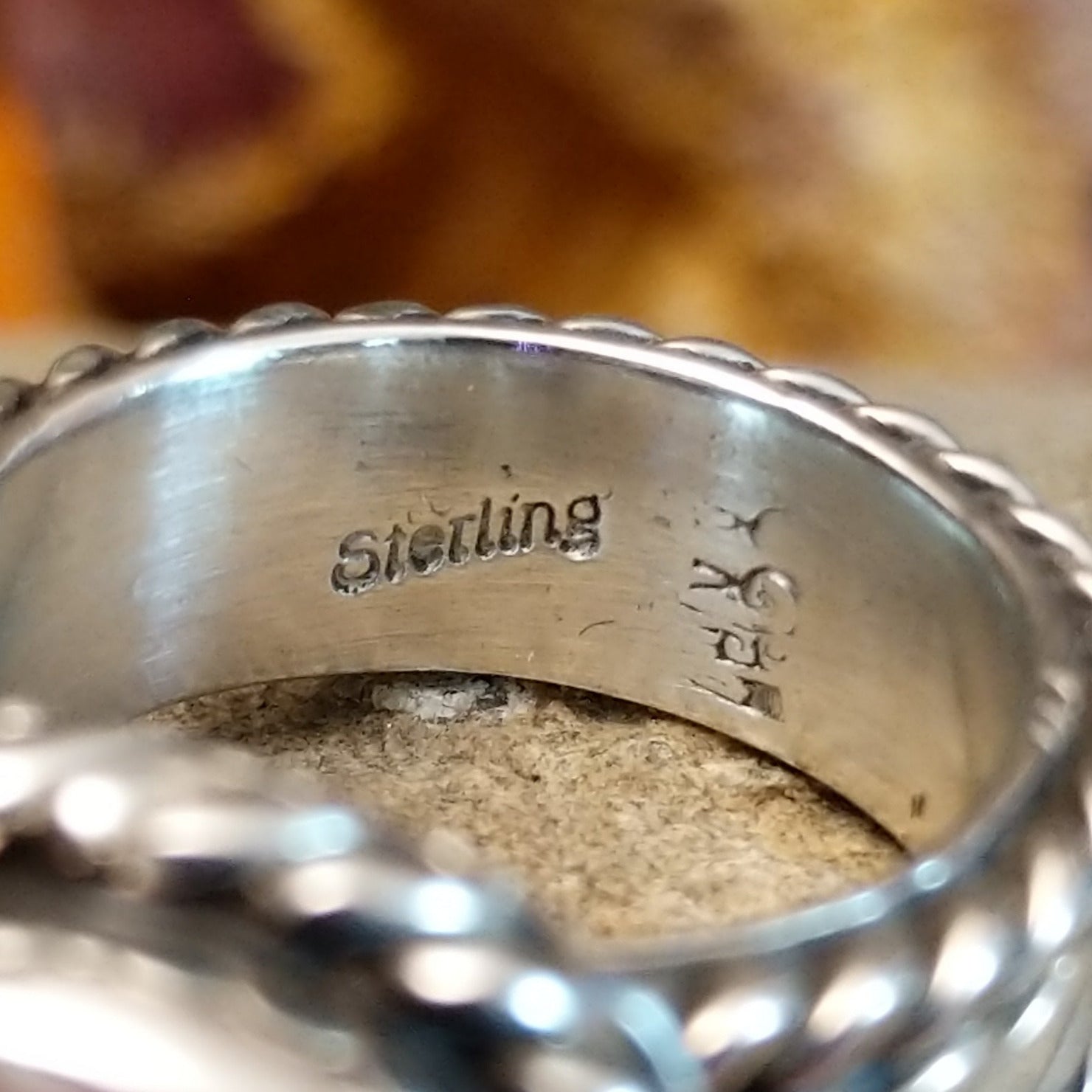 The authentication stamp is on the inside of the band.