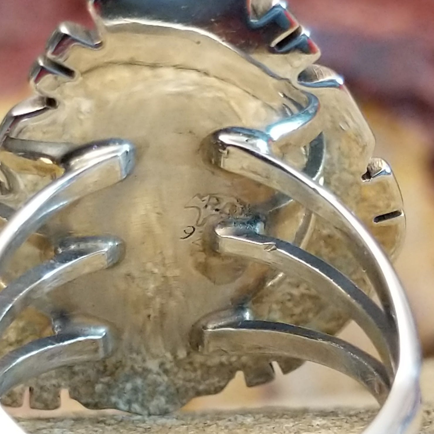 The stamp is found on the underside of the setting.