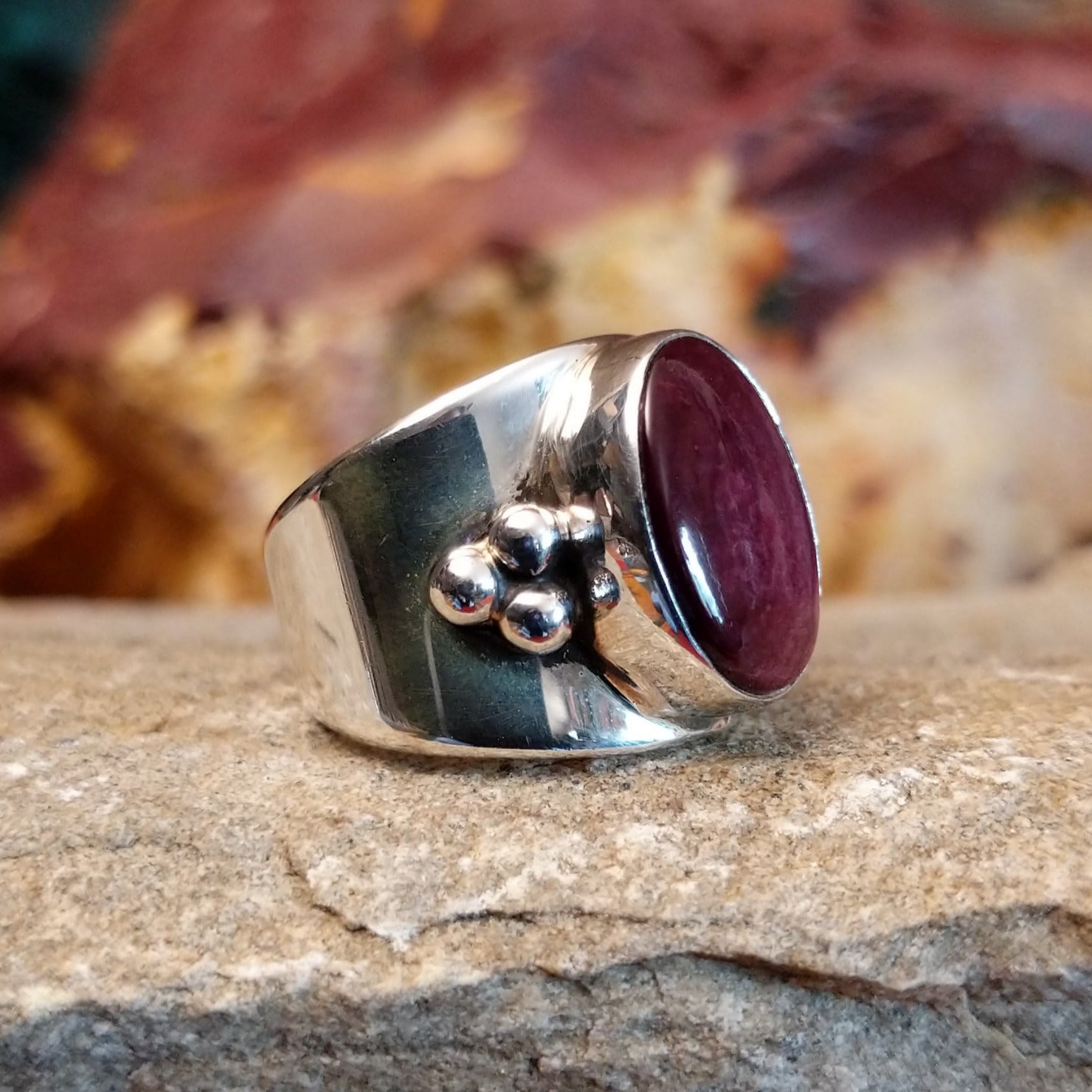 Polished spiny oyster shell ring with dot work on the band.