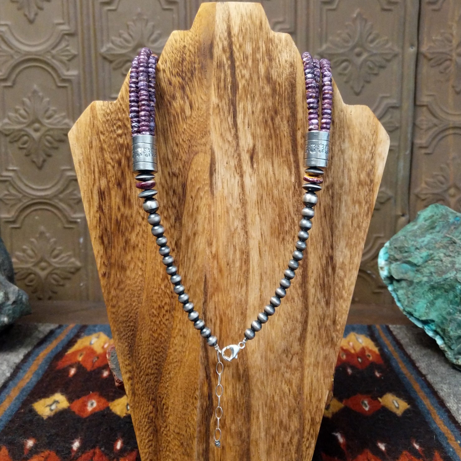 Sterling silver beads with silver clasp on the backing.