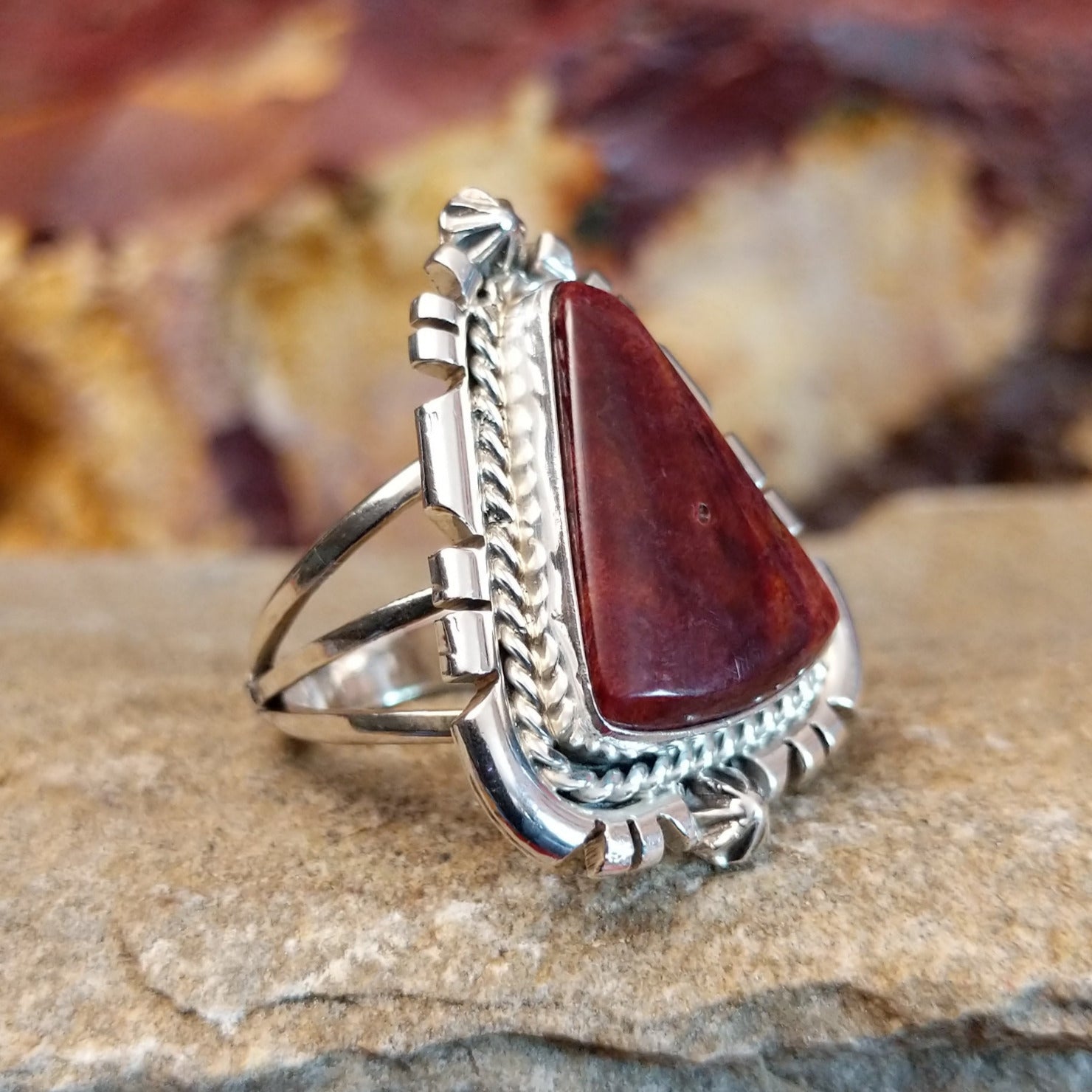 Intricate ridged accents on the silver setting with a purple spiny oyster shell set in it.