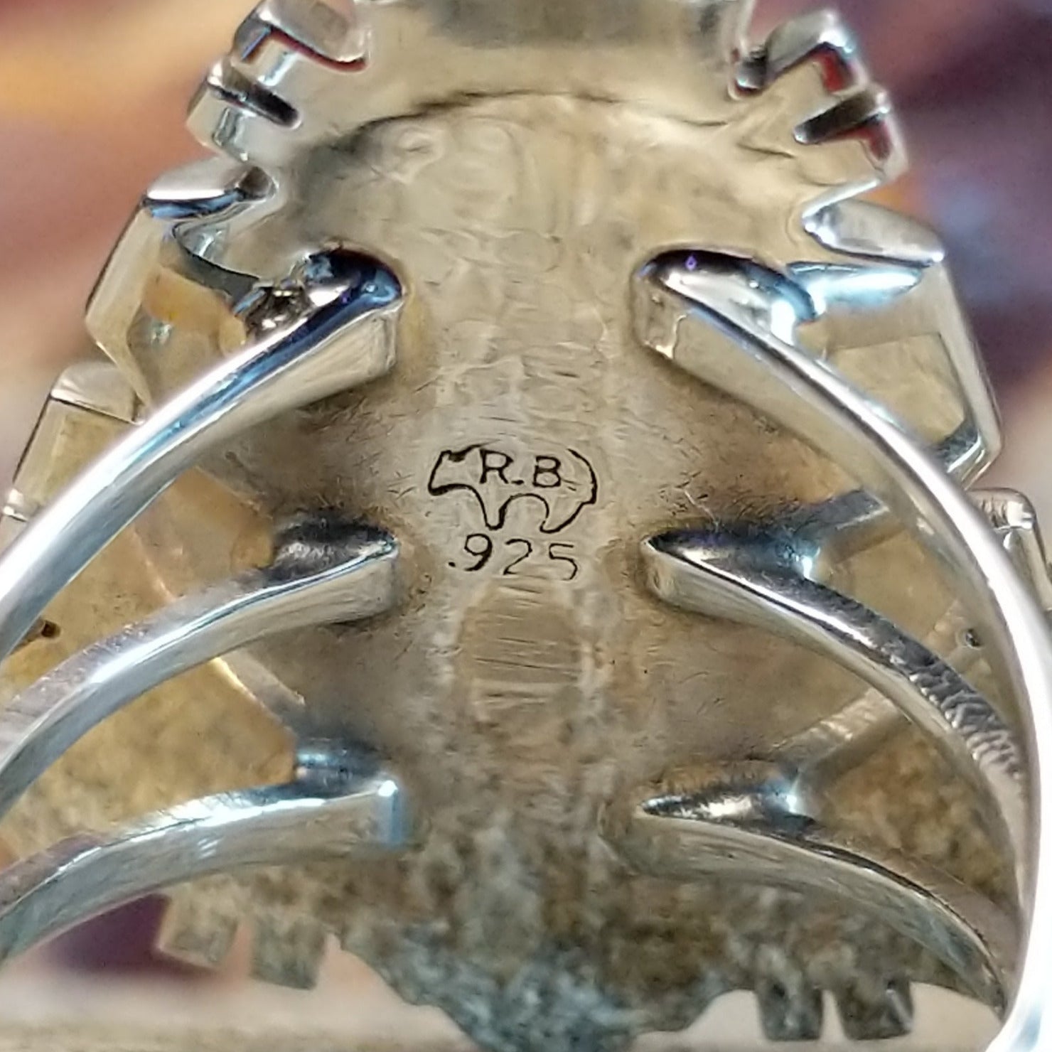 The stamp is found on the inside of the setting.