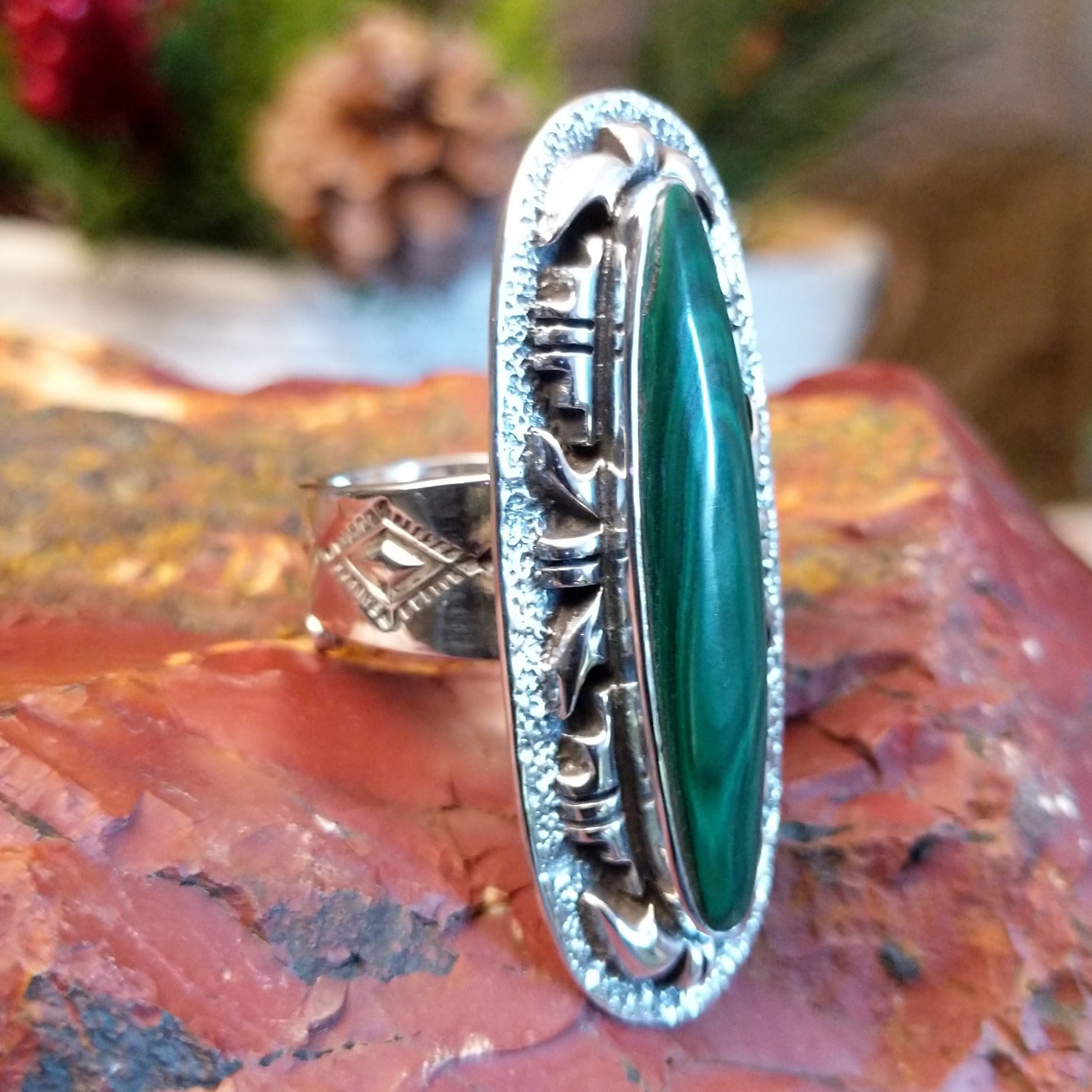Tufa cast sterling silver ring with large malachite stone set in the bezel.