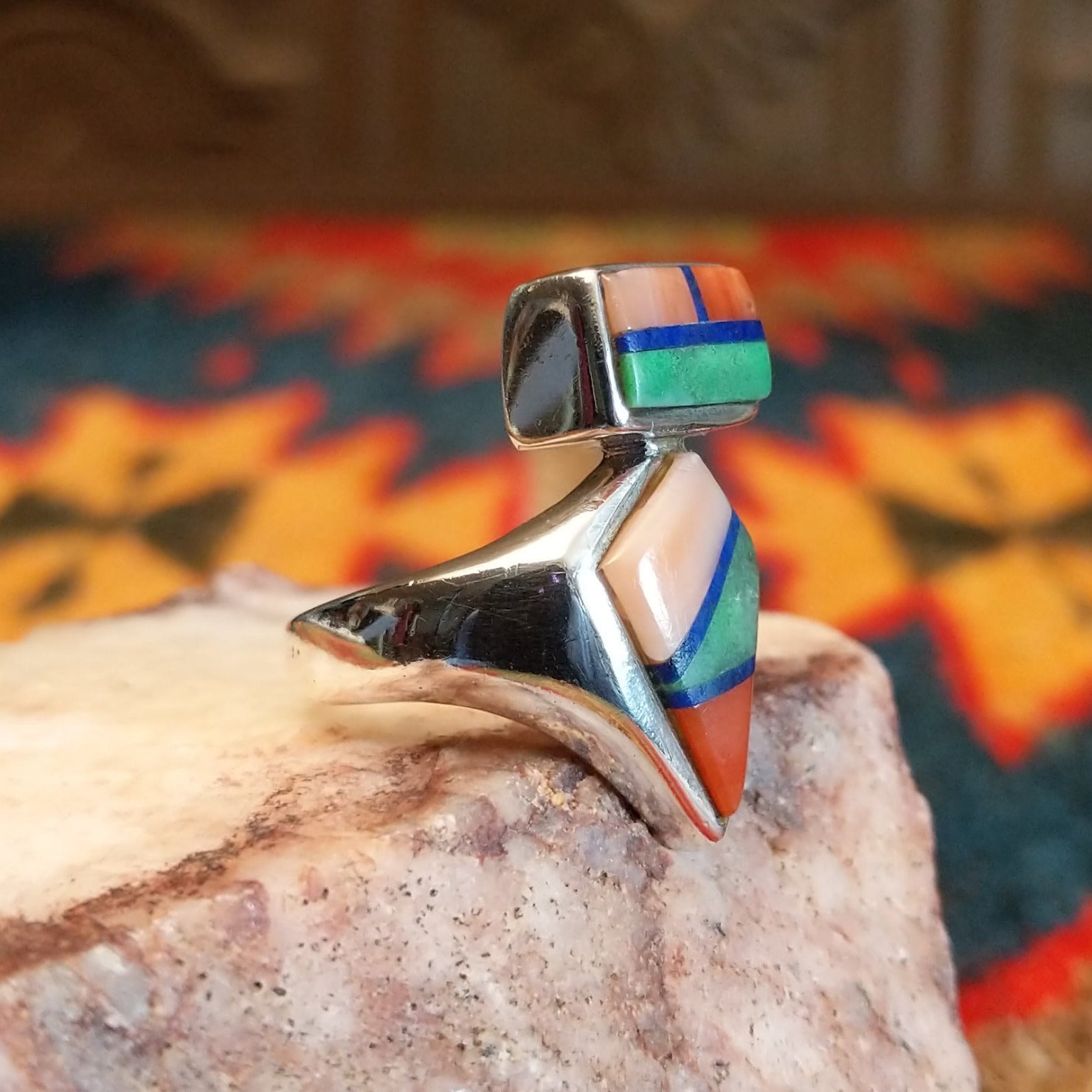 Sterling silver ring with multi-stone inlays set in the geometric bezels.